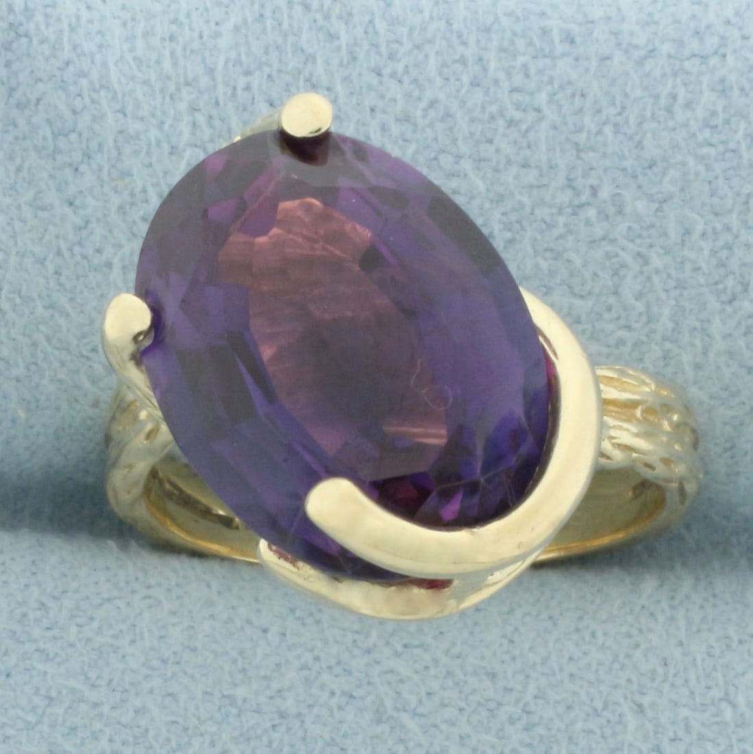 Lab Purple Sapphire Nature Design Ring in 14k Yellow Gold: In 14k yellow gold. Contains one high quality 16mm x 12mm 10ct lab Sapphire gemstone with intense purple blue color and excellent clarity. Size: 7.5. 7.2g.