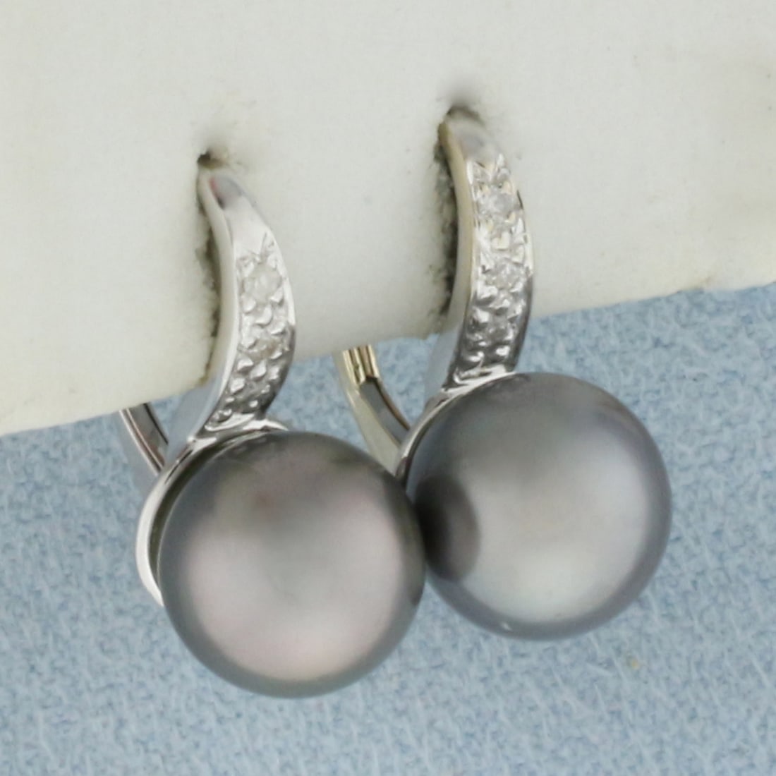 Tahitian Pearl and Diamond Earrings in 14k White Gold: In 14k white gold. Contains two high quality 8.6mm Tahitian pearls with intense silver luster. Also contains six high quality 1/2pt diamonds. Lever back clasp. 3.9g.