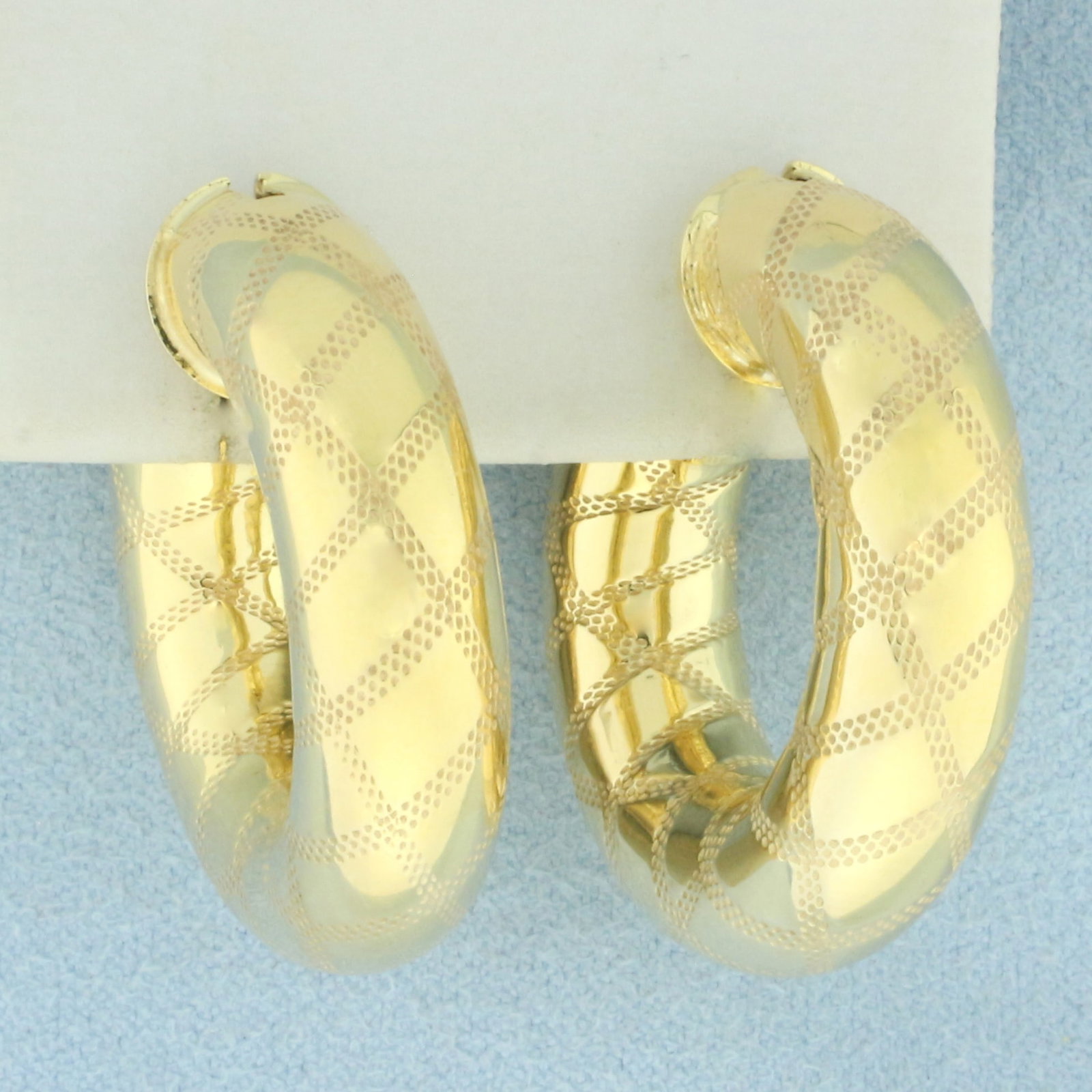 Italian Etched Design Hoop Earrings in 14k Yellow Gold: In 14k yellow gold. Italian made. 8mm thick tubes. 1 1/8 inches long. Locking leverback closures. 9.8g.