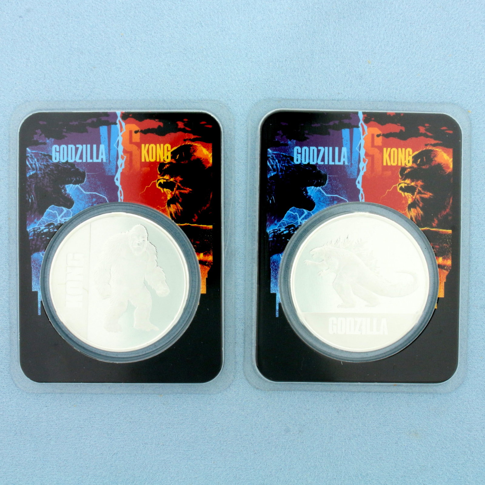2021 Godzilla Vs Kong Silver Collector Coins: Contains two 2021 Republic of Niue Godzilla vs Kong 1oz .999 Fine Silver Coins. Set in original packaging.