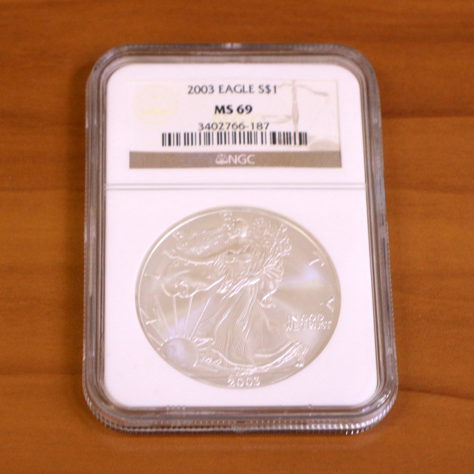 NGC 2003 MS69 Silver Eagle Coin: Contains one 2003 MS69 Silver Eagle Dollar. Packaged by NGC.
