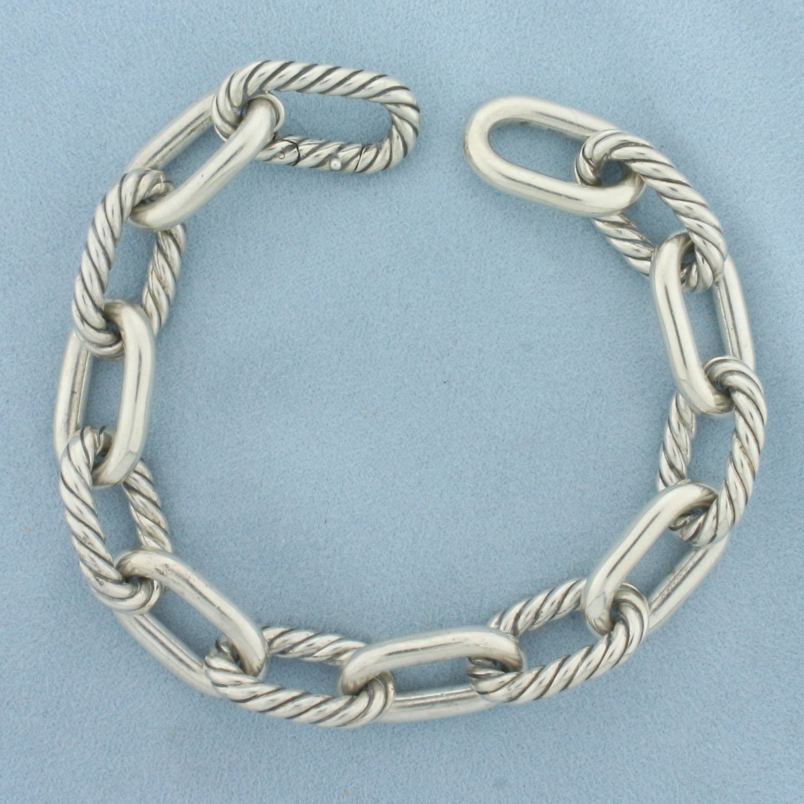 David Yurman Madison Chain Bracelet in Sterling Silver: In .925 sterling silver. Guaranteed Measures 9.25 inches long and 13.5mm wide. Size large - fits up to 8.75 inch wrist. Designer David Yurman marks. Spring Clasp. 62.0g.
