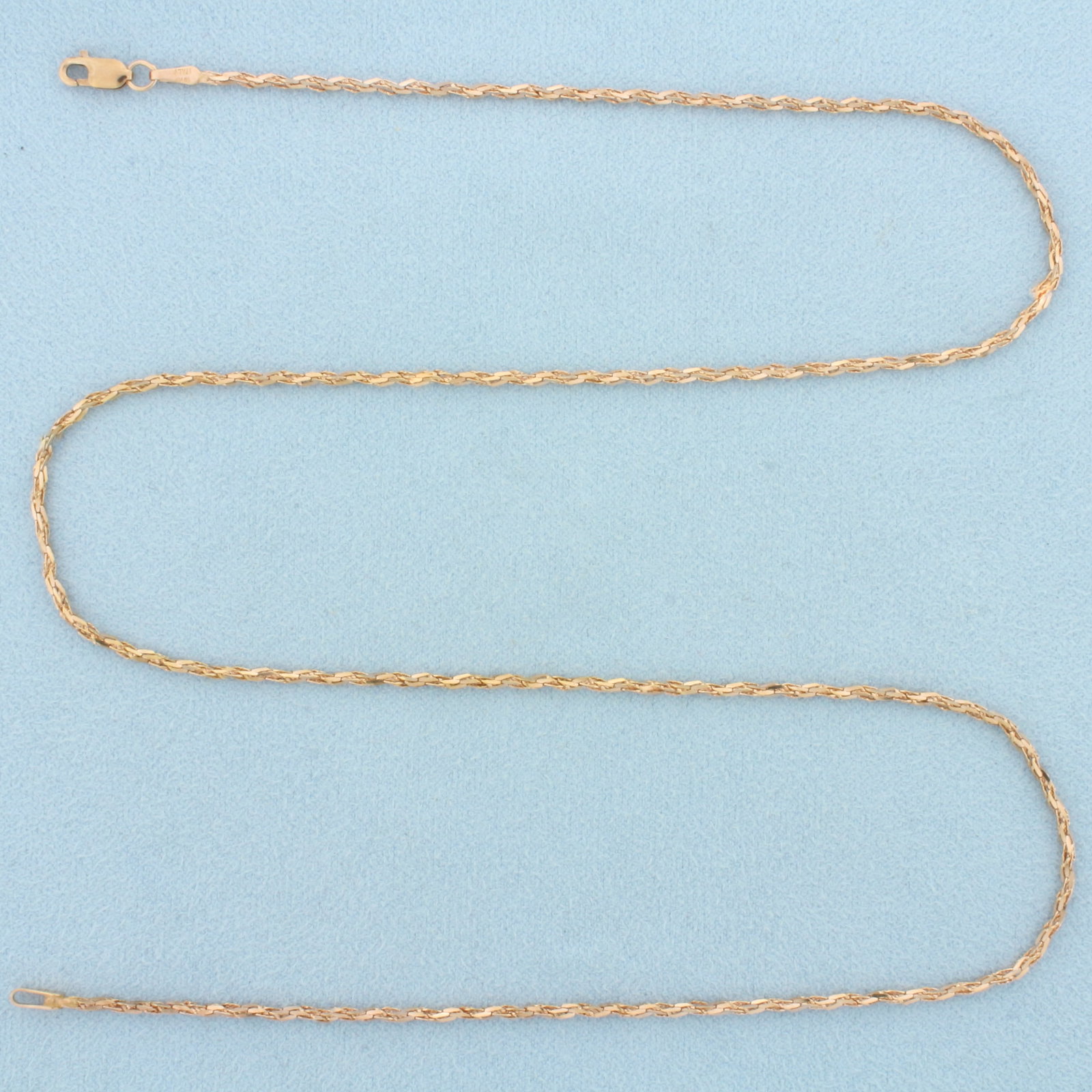 Italian 20 Inch Twisting Bevel Link Chain Necklace in 18k Rose Gold: In 18k Rose Gold. 20 inches long. 1.6mm wide. Italian made. Lobster clasp. 4.7g.