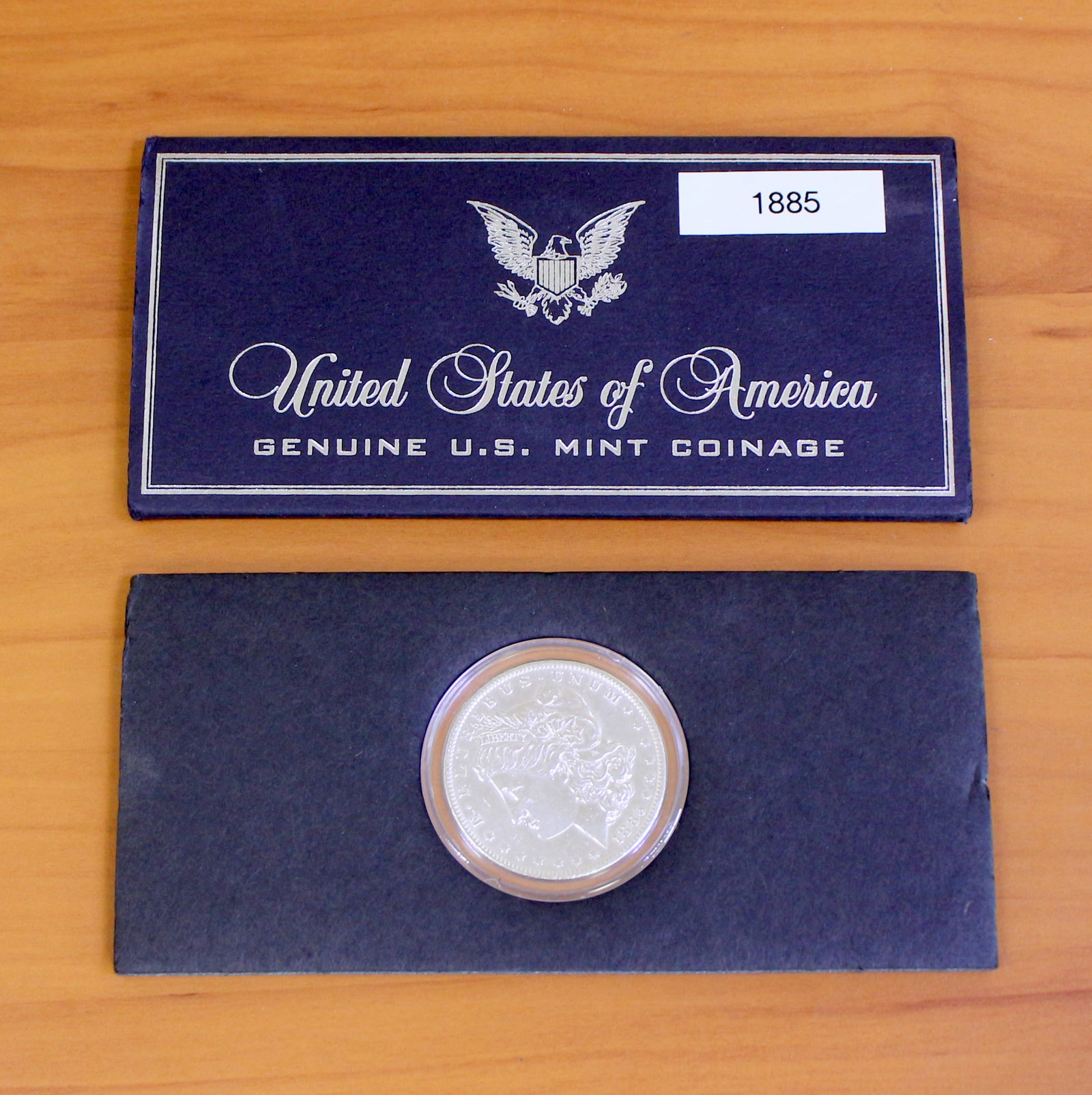 US Mint Morgan Silver Dollar: One Morgan Silver Dolar from 1884-1896. Coin in very good condition, Extra Fine plus. Coin in Set in packaging.