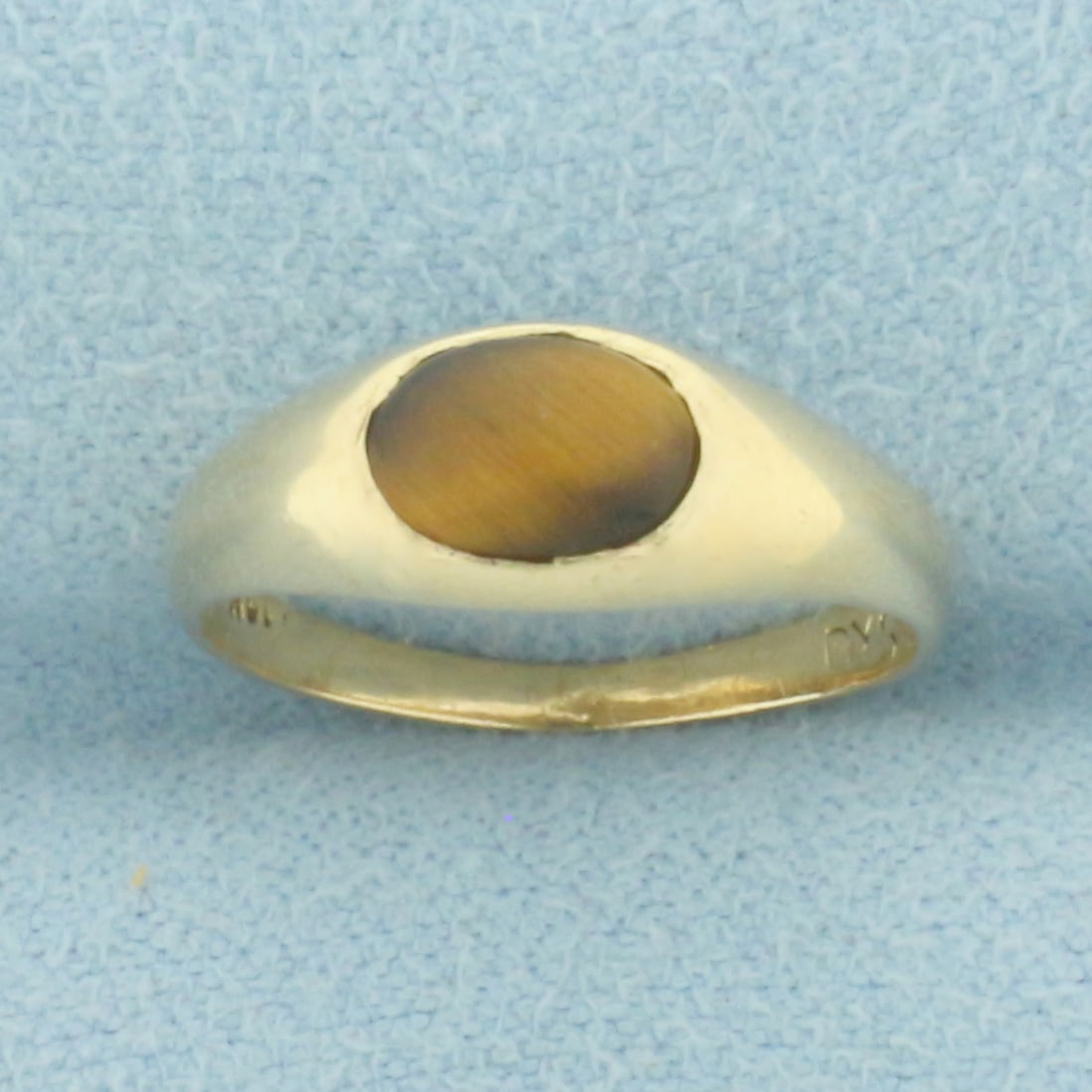 Tiger's Eye Pinky Ring in 10K Yellow Gold: In 10k yellow gold. Contains a high quality natural 7mm Tigers Eye gemstone. Size 3.5. 1.3g