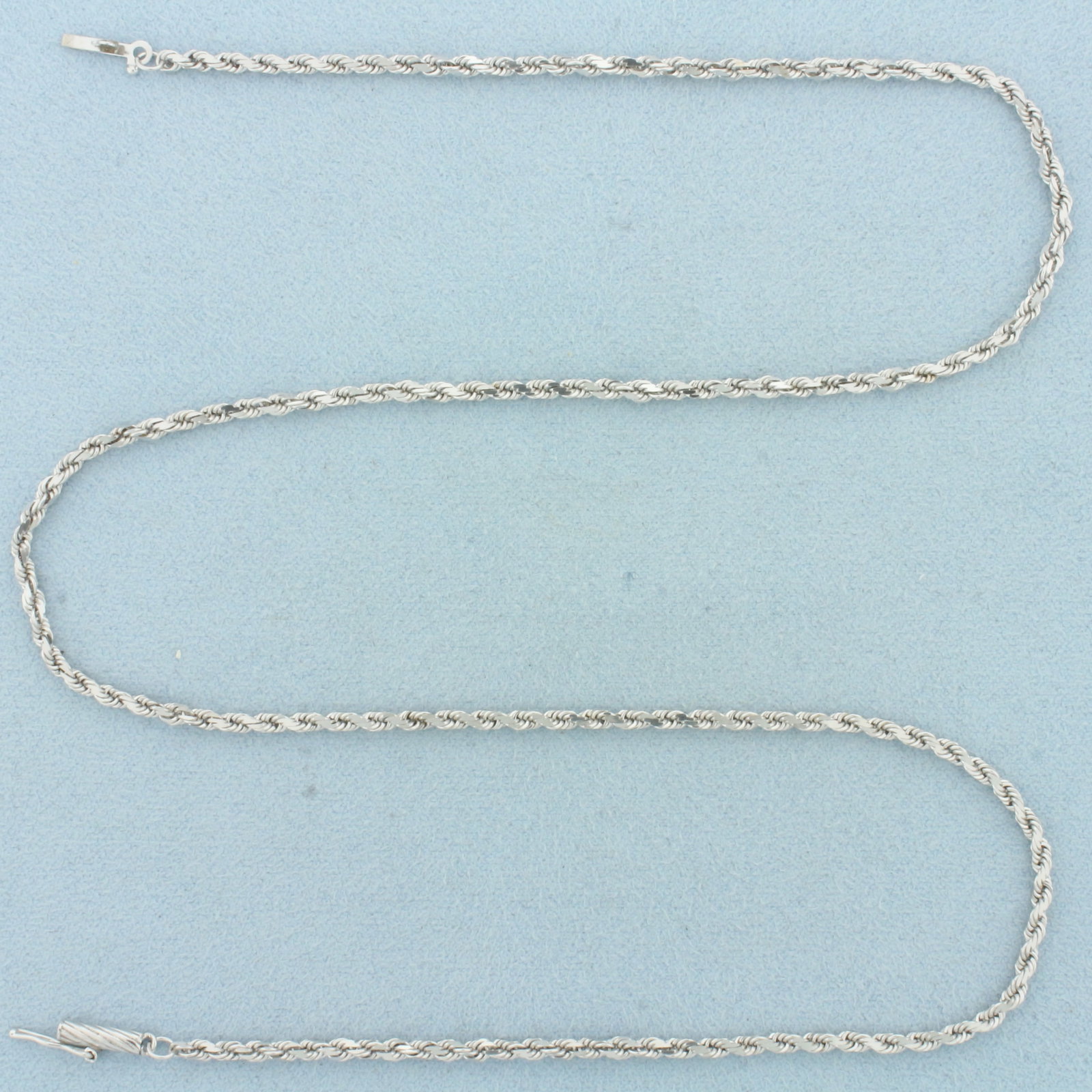 18 Inch Rope Link Chain Necklace in 14k White Gold: In 14k White Gold. 18 inches long. 2mm wide. Rope link. Slide clasp with safety latch. 7.9g.