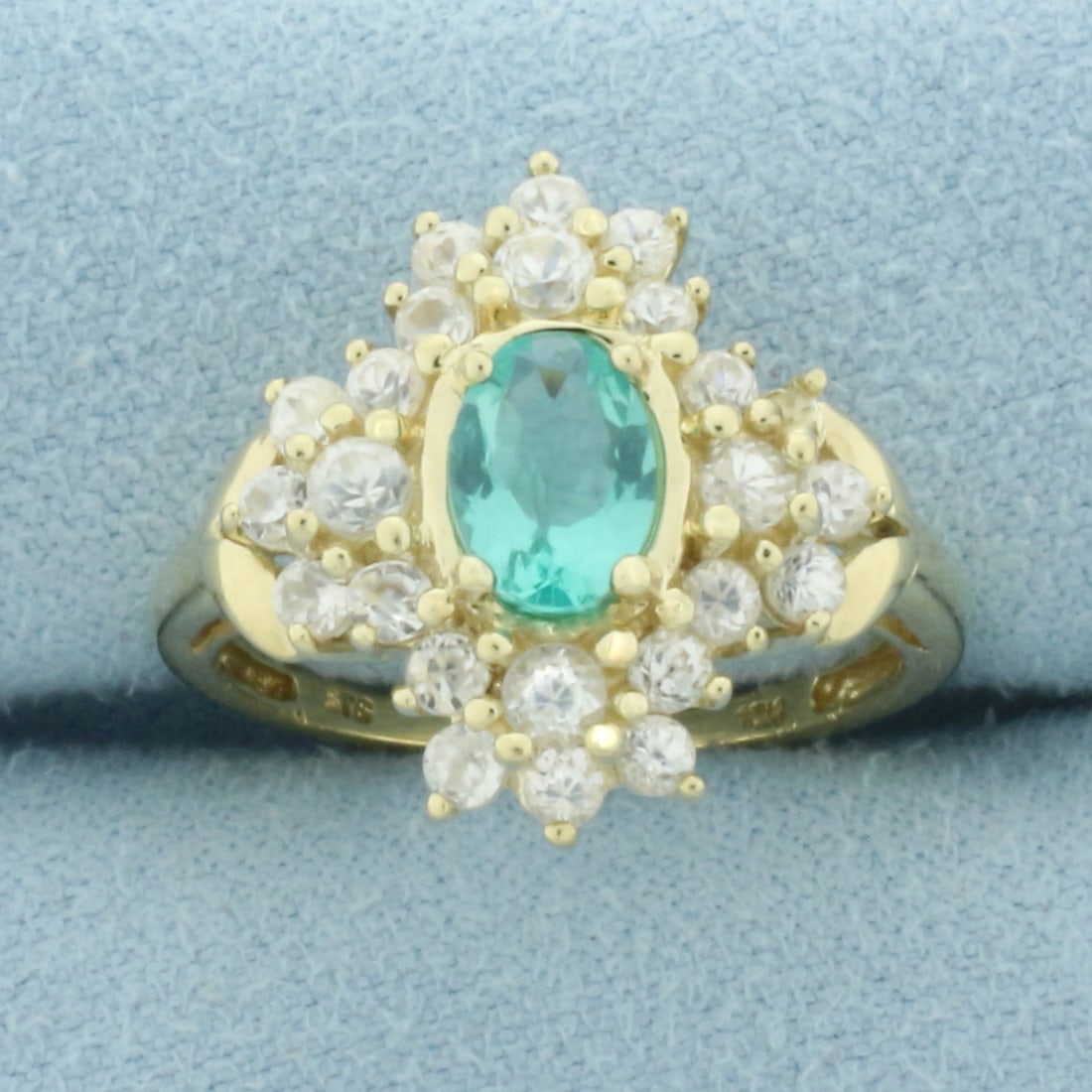 Tourmaline and White Sapphire Ring in 10k Yellow Gold: In 10k Yellow Gold. Contains one 5x7mm high quality oval cut natural Tourmaline gemstone, approximately 1ct, with vibrant color and excellent clarity. Also contains twenty four high quality white sapp