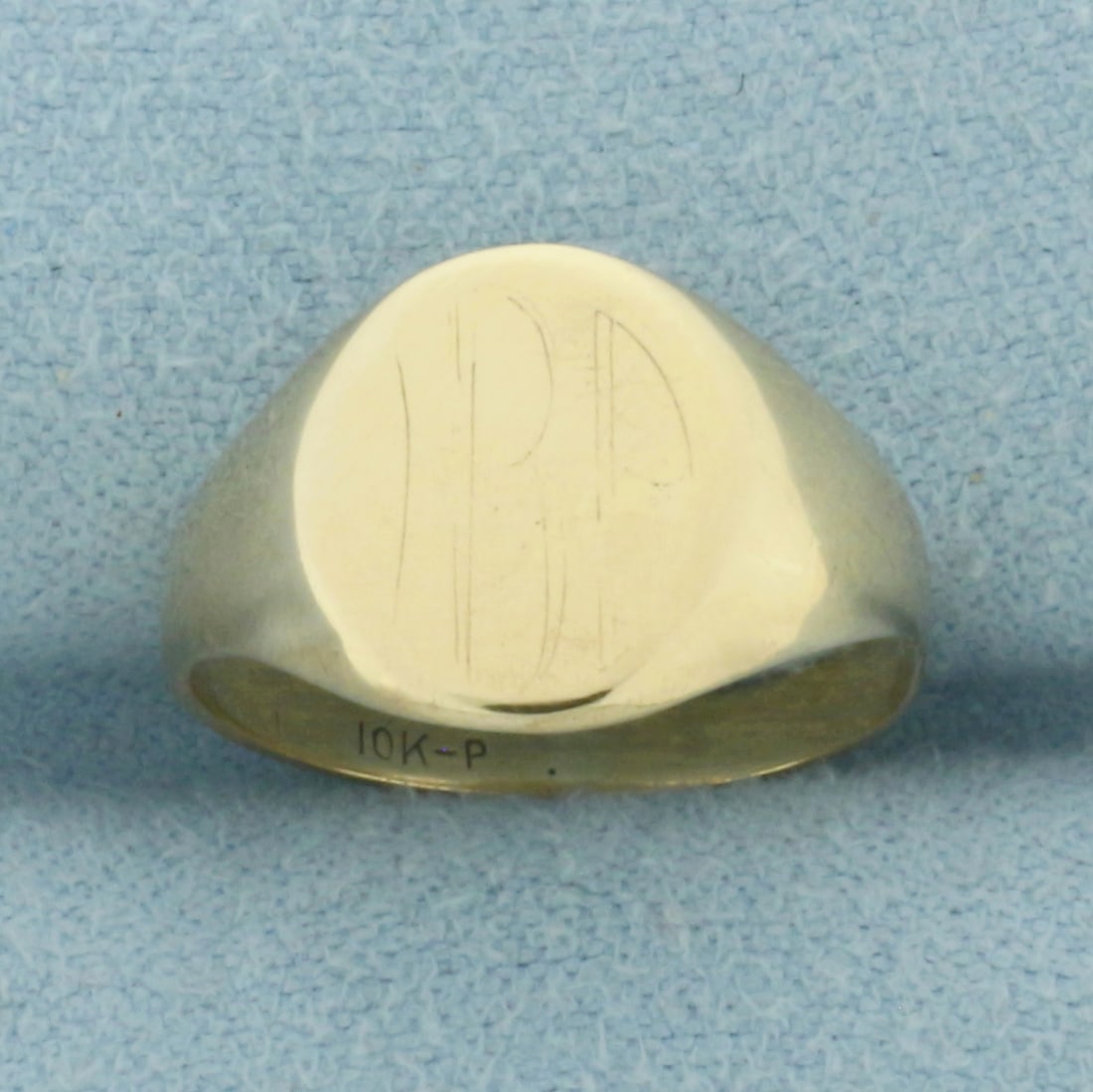 Vintage Signet Ring in 10K Yellow Gold: In 10k yellow gold. Measures 11mm wide at top center. Extremely faint initials, too faint to read, can be buffed out and new monogram added if desired. Size 5. 2.3g