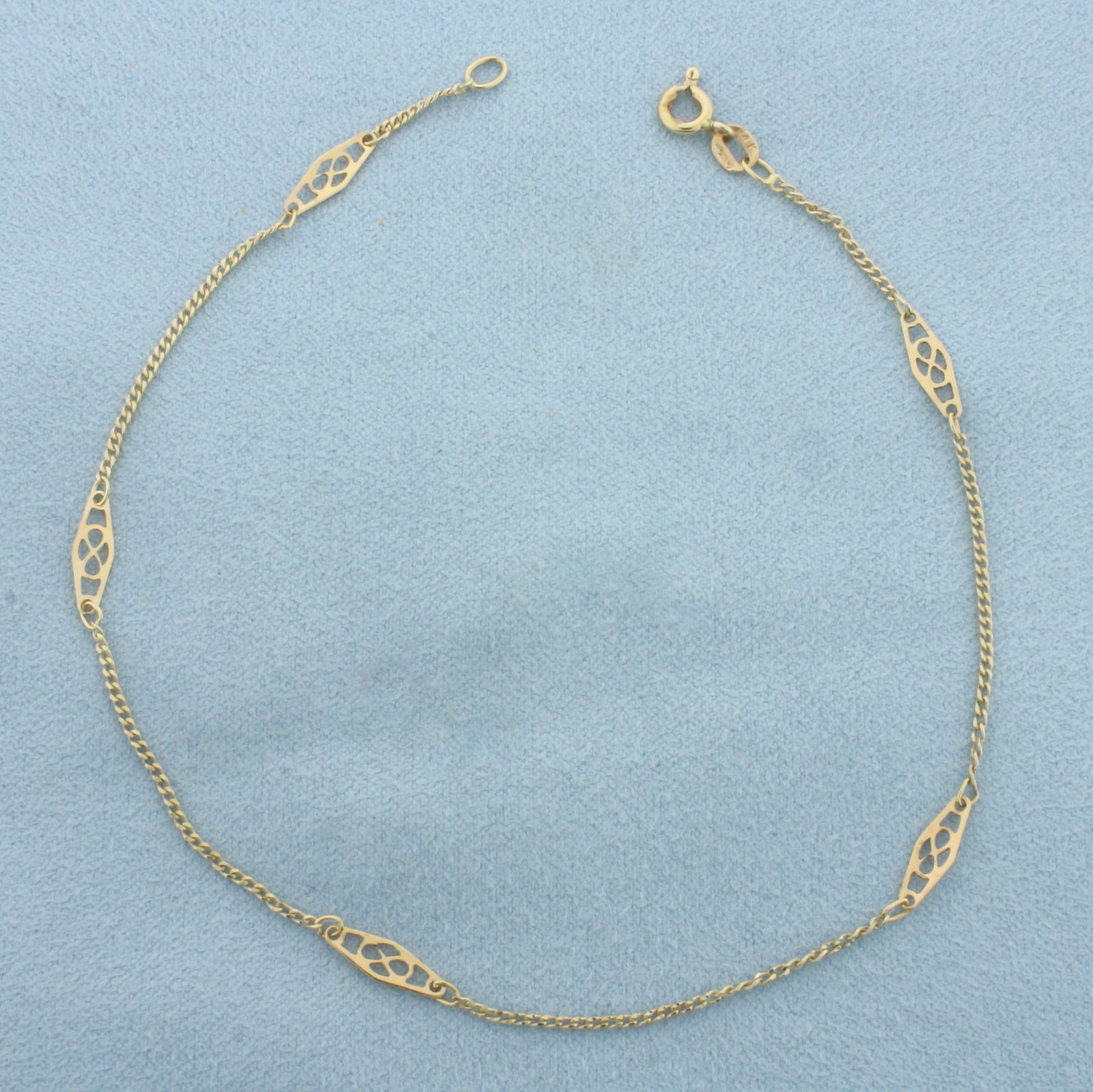 Infinity Station Anklet in 14k Yellow Gold: In 14k Yellow Gold. 9 3/4 inches long. 3.7mm wide. Spring clasp. 1.5g.