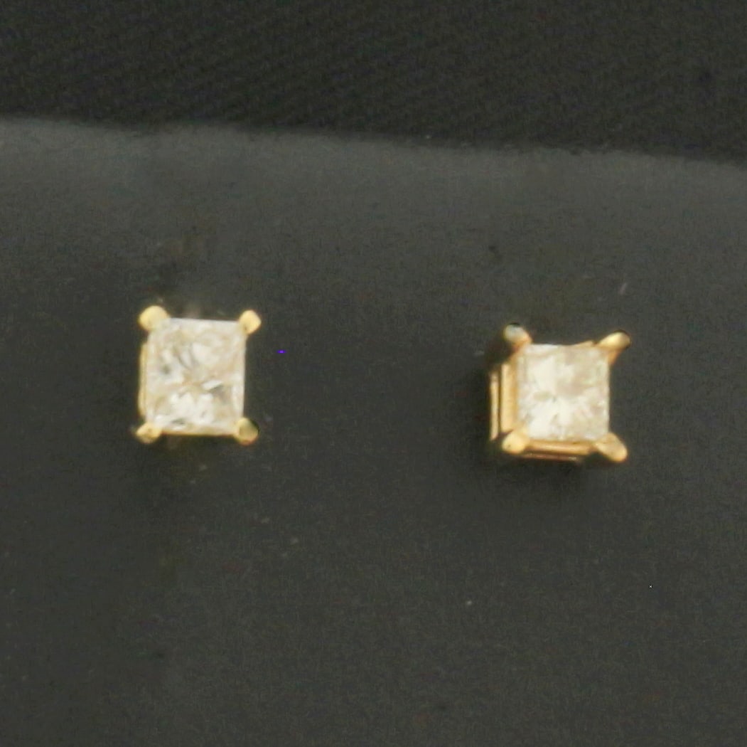 Princess Cut Diamond Stud Earrings in 14k Yellow Gold: In 14k Yellow Gold. Contains two 2.5mm high quality princess cut diamonds, 1/4ct TW, I color/I clarity, eye clean, great cut for added brilliance. Friction backs. .5g.