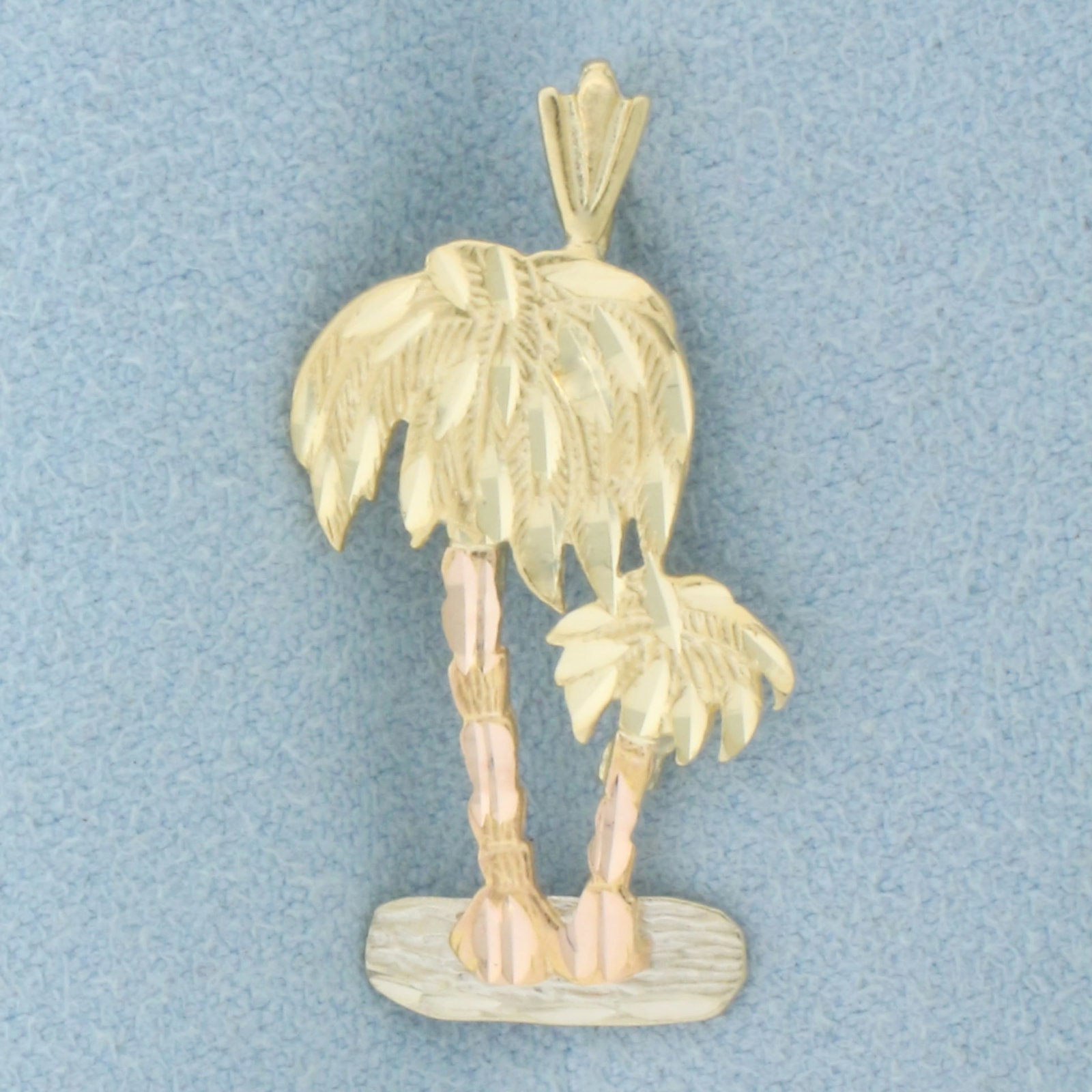 Diamond Cut Palm Tree Pendant in 14k White, Yellow, and Rose Gold: In 14k White, Yellow, and Rose Gold. 1 3/8 inch long, 1/2 inch wide. Diamond cut for added brilliance. 1.7g.