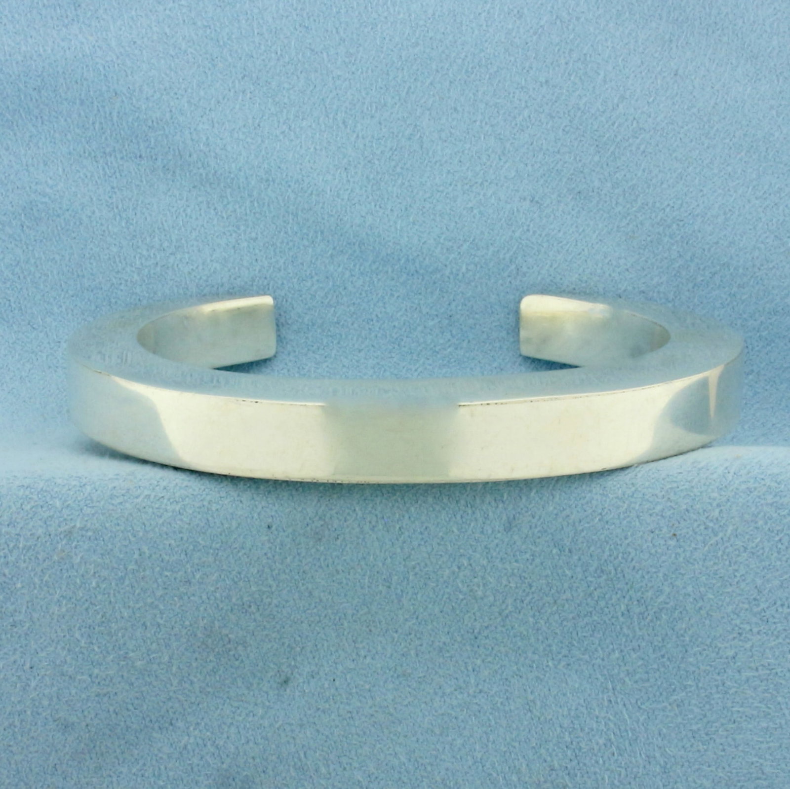 Modern Cuff Bracelet in Sterling Silver: In .925 Sterling Silver. Interior cuff dimensions: 2 3/8 inch by 1 7/8 inch. 8.5mm wide. 24.6g.