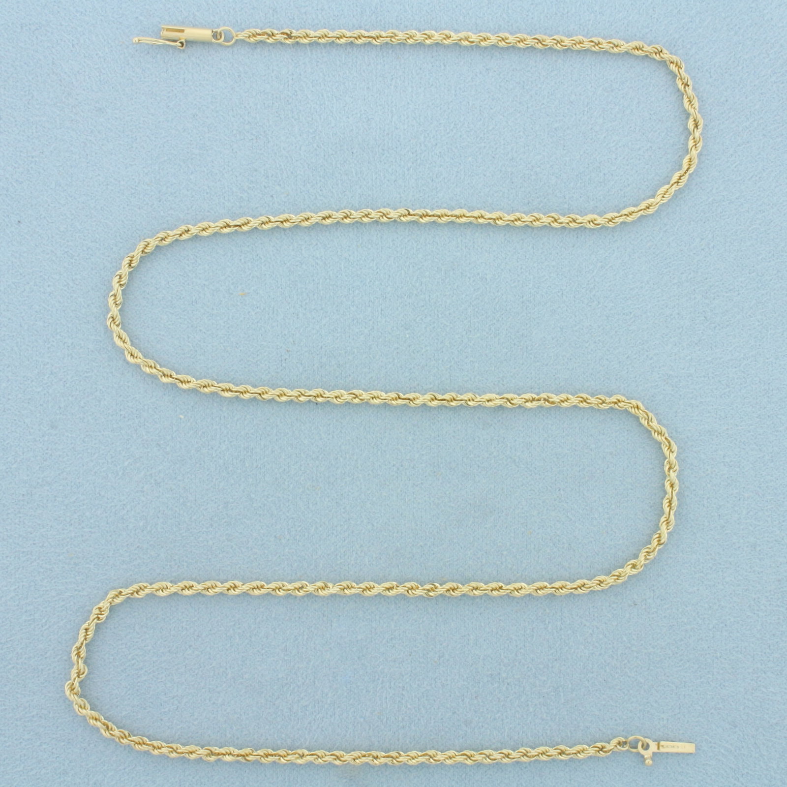 20 Inch Rope Link Chain Necklace in 14k Yellow Gold: In 14k Yellow Gold. 20 inches long. 2.2mm wide. Barrel clasp with safety latch. 8.8g.