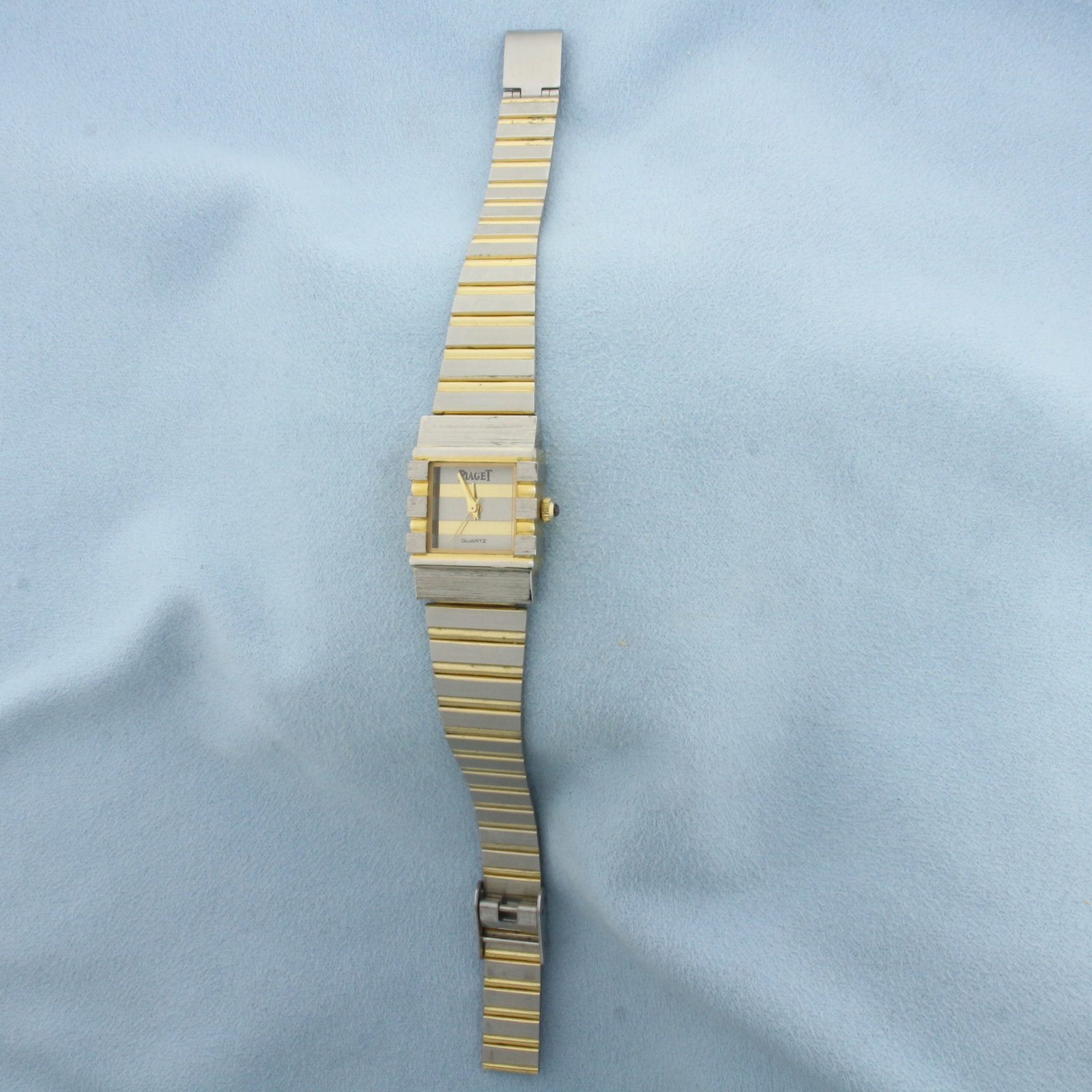Ladies Piaget Two Tone Quartz Watch: Stainless Steel. 7 1/2 inches long. 22mm case. Quartz movement runs great, new battery.