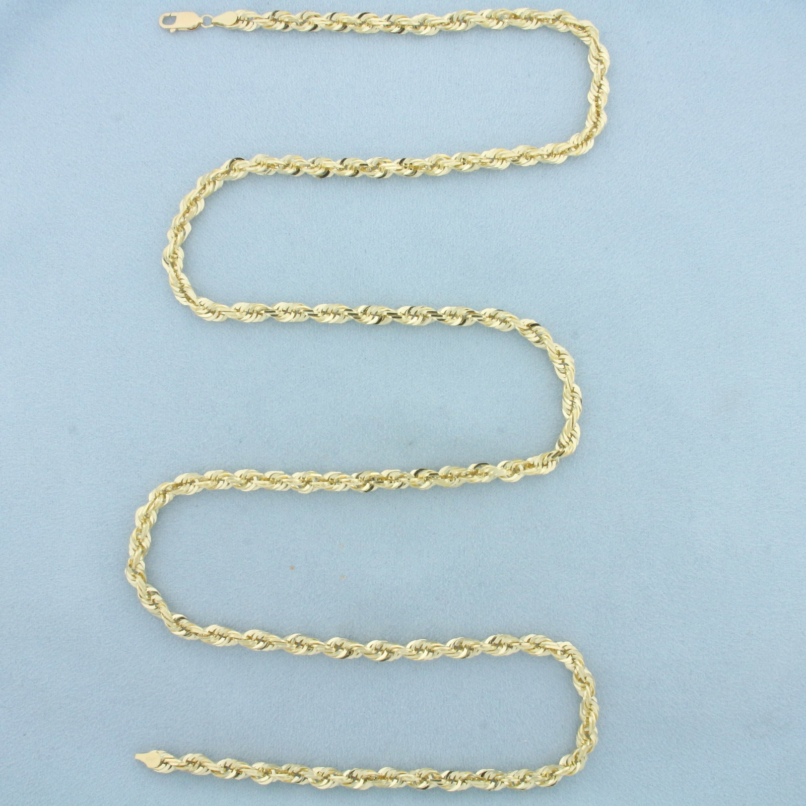 30 Inch Rope Link Chain Necklace in 10k Yellow Gold: In 10k Yellow Gold. 30 inches long. 5.1mm wide. Lobster clasp. 46.9g.