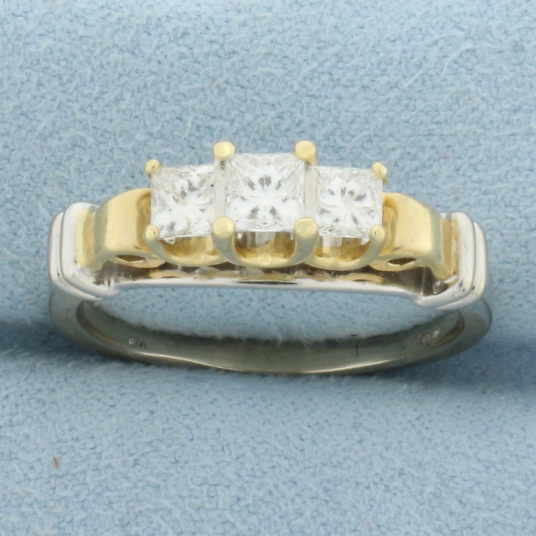 Princess Diamond Three Stone Wedding or Anniversary Ring in 14K Yellow and White Gold: In 14K Yellow and White Gold. Contains three high quality princess diamonds, one .42ct and two .28cts each, SI clarity/G color with excellent cut for lots of sparkle. Engraved in the inside band is "p