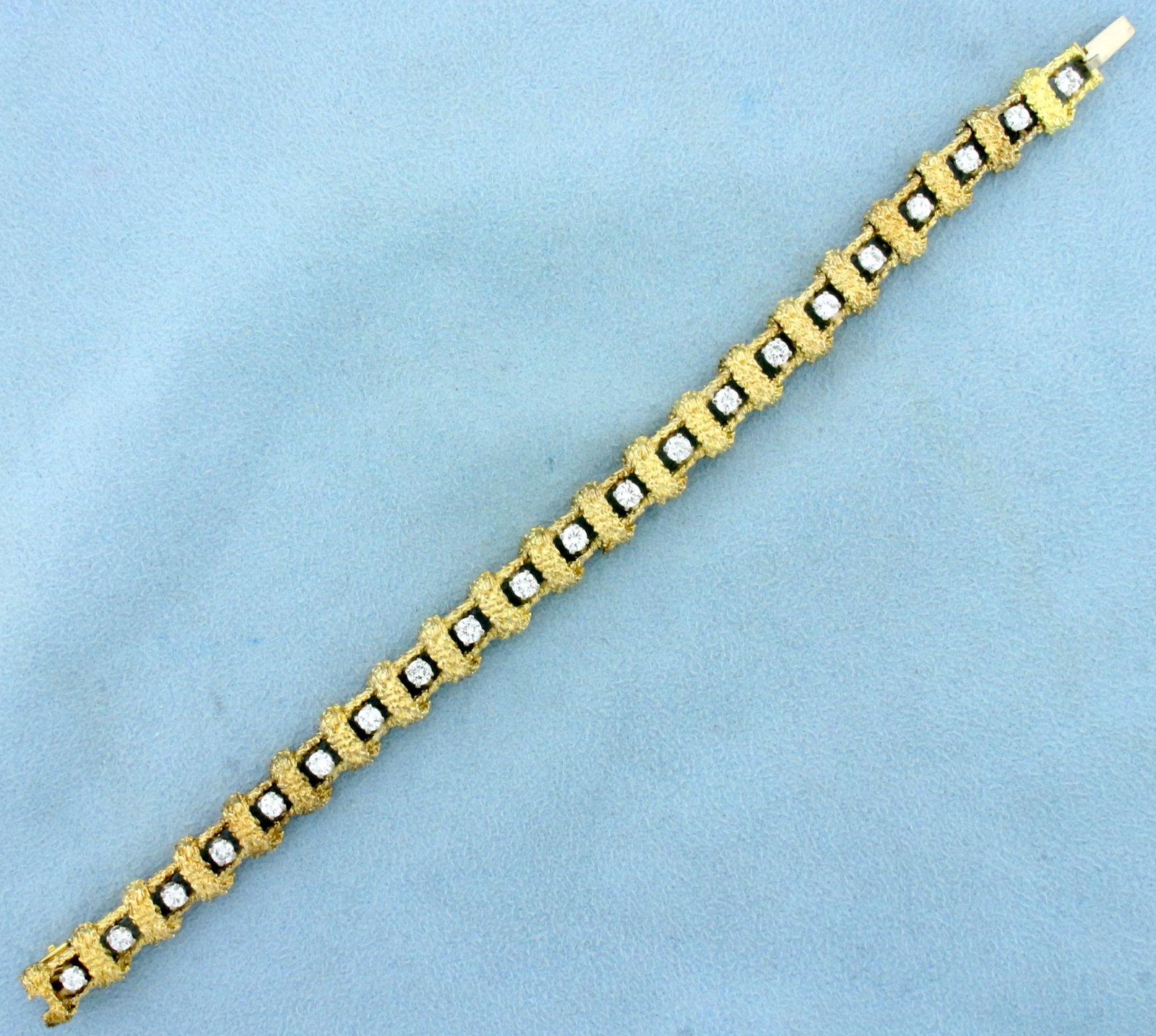 Nugget Style Diamond Tennis Bracelet in 18K Yellow Gold: In 18K Yellow Gold. Contains twenty one high quality diamonds, 2ct TW, VS clarity/G color. 7 inches long. 8.8mm wide. Safety Clasp. 31.1g