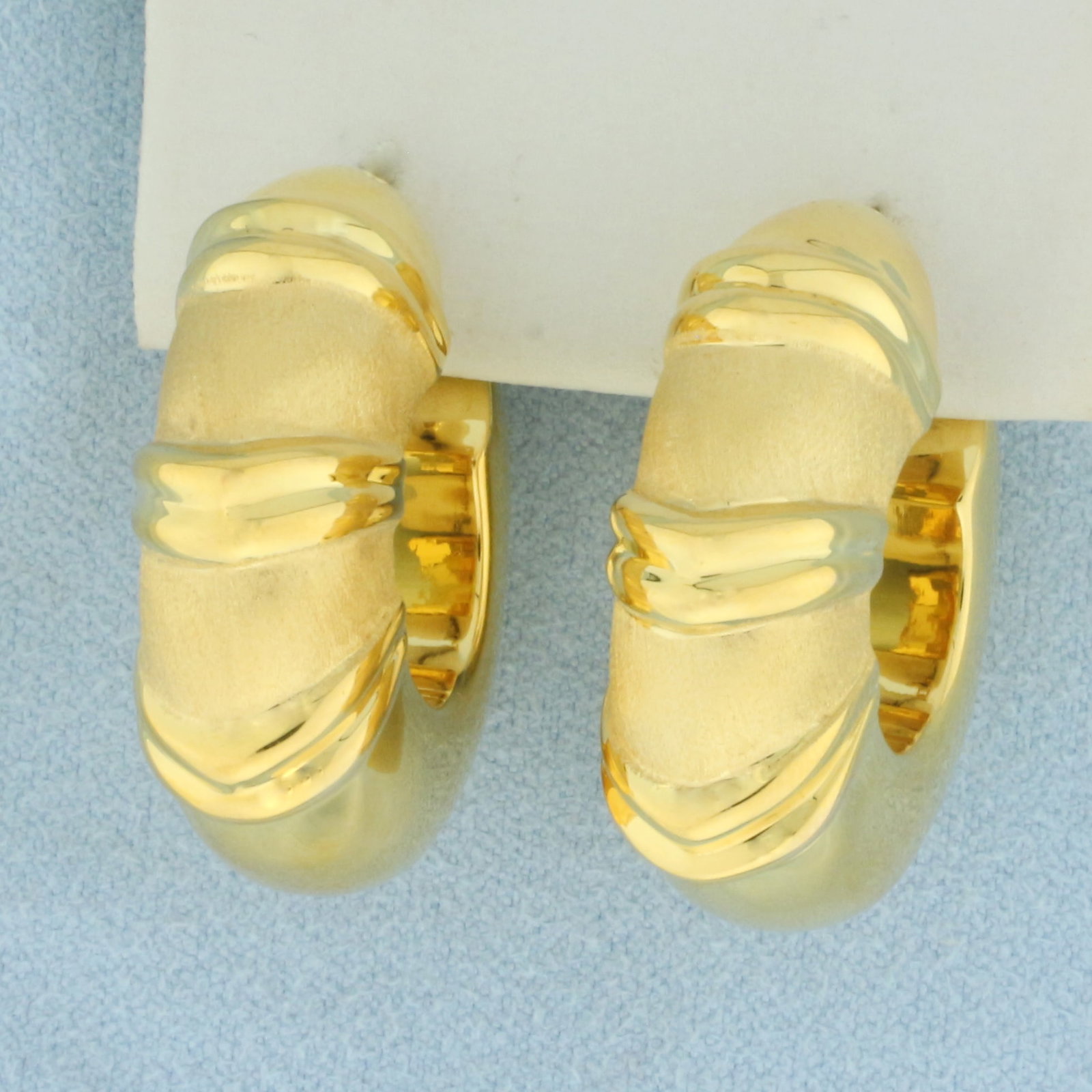 Satin and High Polish Wide Tube Hoop Earrings in 18k Yellow Gold: In 18k Yellow Gold. 1 1/8 inch long. 10mm tubes. 7.8g.