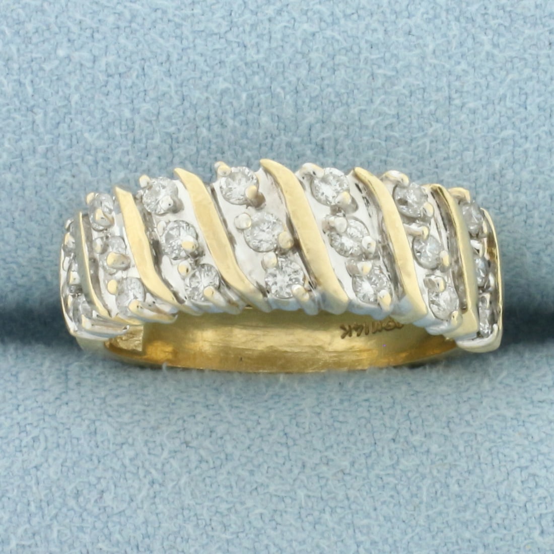 Diagonal Set Diamond Band Ring in 14k Yellow Gold: In 14k Yellow Gold. Contains twenty-one high quality diamonds, 1/2ct TW, SI clarity. H color. 7mm wide. Size 7. 5.2g.