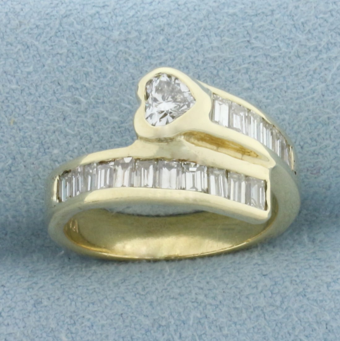 Heart and Baguette Diamond Bypass Ring in 14k Yellow Gold: In 14k Yellow Gold. Contains one 1/3ct high quality heart shaped diamond and seventeen baguette diamonds, 2/3ct TW, VS clarity/G color. 1ct TW. 12.7mm wide on top. Size 6.25. 5.8g.