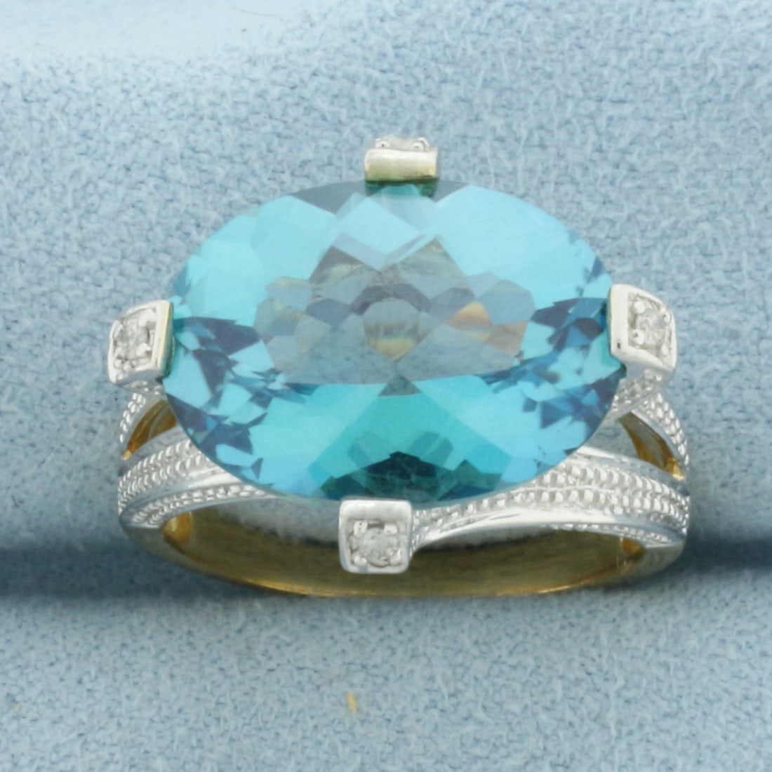 Topaz and Diamond Ring in 10k Yellow and White Gold: In 10k Yellow and White Gold. Contains one 12x16mm high quality fancy checkerboard Topaz gemstone, approximately 10ct, with vibrant color and excellent clarity. Also contains four high quality .01ct