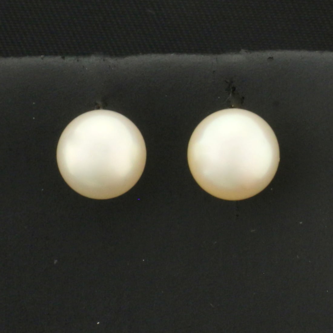 7mm Cultured Akoya Pearl Stud Earrings in 14k Yellow Gold: In 14k Yellow Gold. Contains two 7mm cultured Akoya Pearls with high luster. Friction backs. 1.8g.
