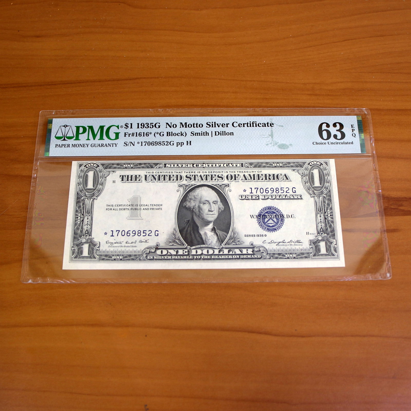 PMG 63 1935G $1 Silver Certificate Fr#1616 Choice Uncirculated Federal Reserve Note: PMG graded 63 $1 Silver Certificate. Uncirculated. No Motto (before "In God We Trust" was printed on back of the note) See pictures for exact note you will receive and condition