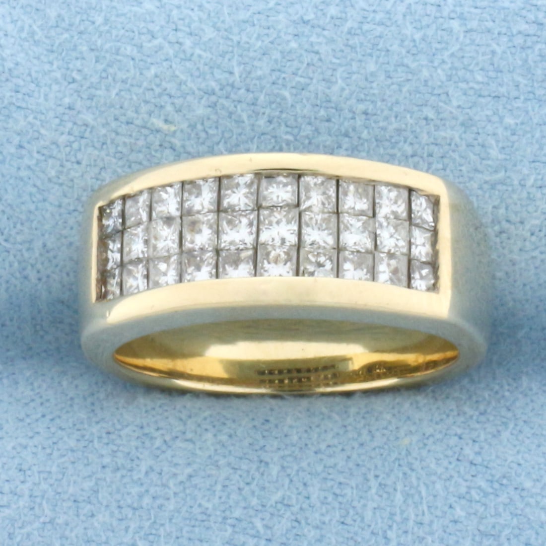 Invisible Set Diamond Ring in 14k Yellow Gold: In 14k Yellow Gold. Contains thirty 2mm invisible set princess high quality diamonds, 1.5ct TW, VS clarity/H color. 7.5mm wide at center. Size 6.5. 7.8g.