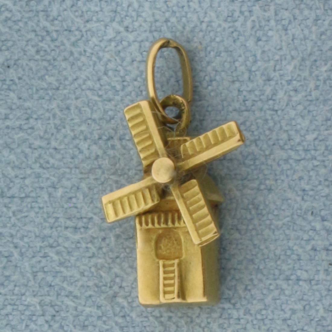 Mechanical Windmill 3-D Charm in 14k Yellow Gold: In 14k yellow gold. 0.625 inches long by 0.375 inches wide. Windmill blades spin. .8g.