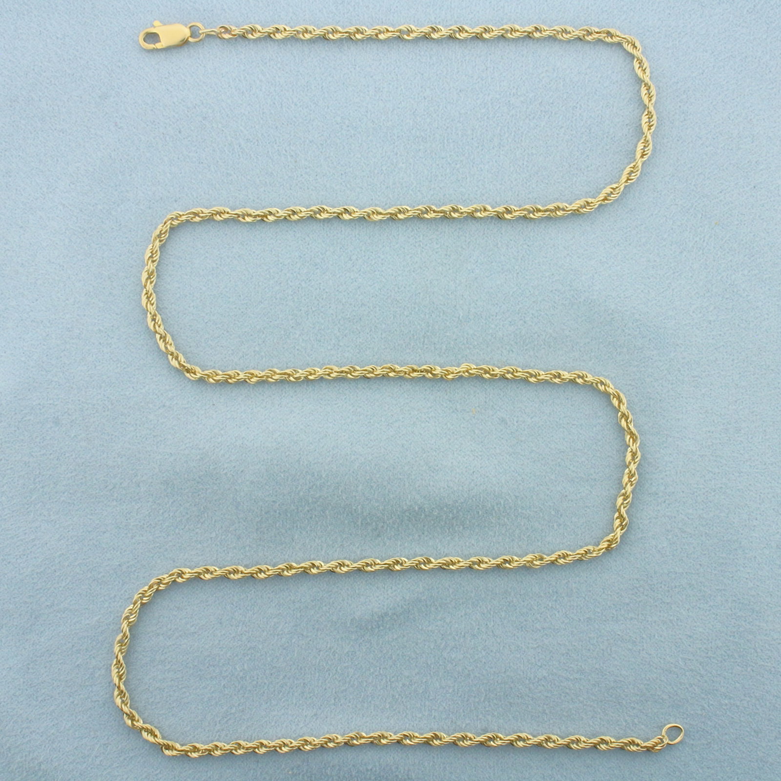 22 Inch Rope Link Chain Necklace in 14k Yellow Gold: In 14k Yellow Gold. 22 inches long. 2.5mm wide. Lobster clasp. 10.1g.