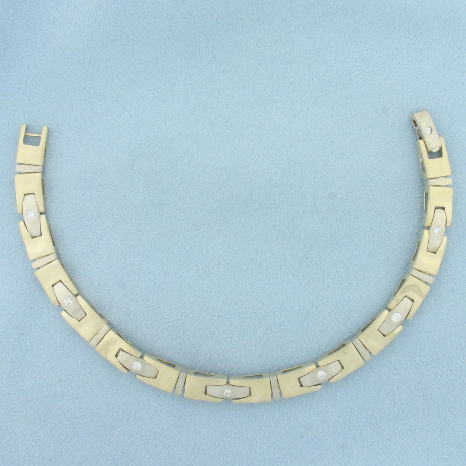 Vintage Men's Satin Finish Diamond Bracelet in 14k Yellow and White Gold: In 14k Yellow and White Gold. Contains eight high quality .07ct diamonds, VS clarity/G color. 8 5/8 inch long. 8mm wide. Satin finish. Minor dents, indicative of age, not noticeable. Concealed wrap ar