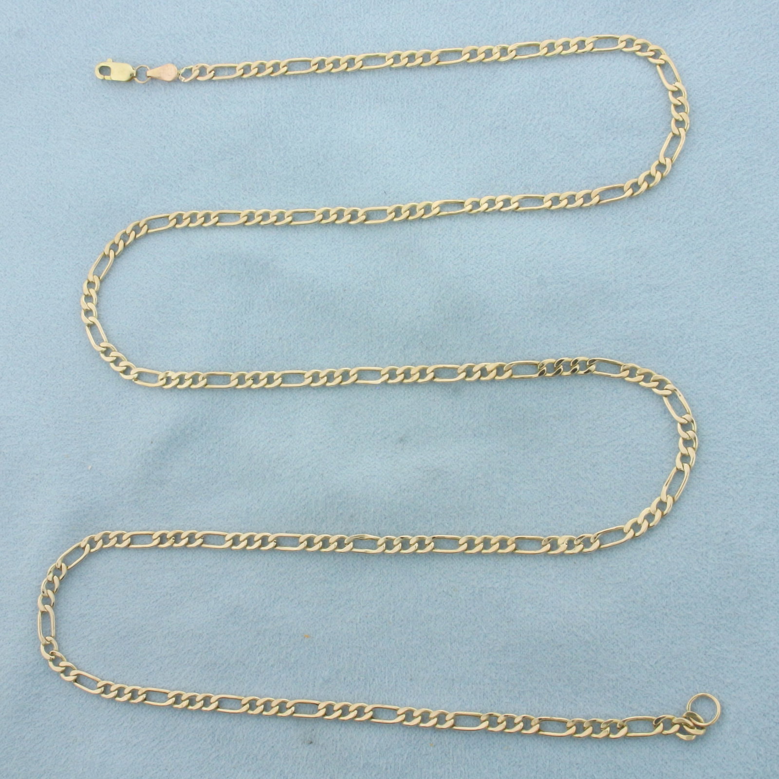 Mens 24 Inch Italian Figaro Link Chain Necklace in 10k Yellow Gold: In 10k Yellow Gold. 24 inches long. 3.1mm wide. Italian made. Lobster clasp. 3.0g.