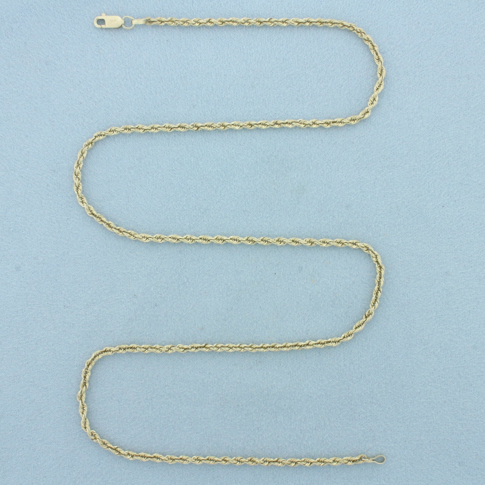 18 Inch Rope Link Chain Necklace in 14k Yellow Gold: In 14k Yellow Gold. 18 inches long. 2.2mm wide. Lobster clasp. 2.6g.