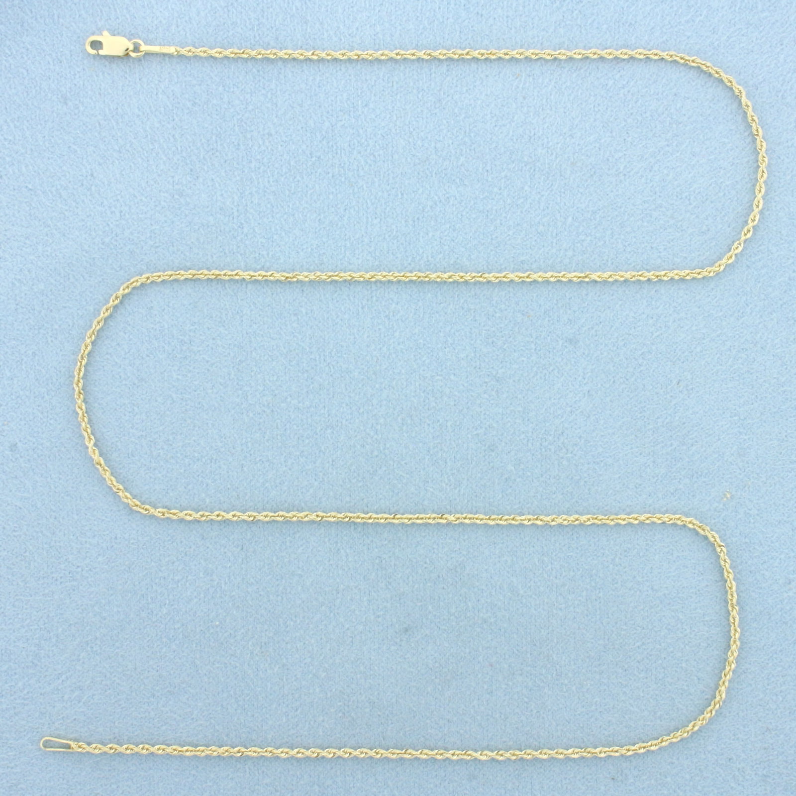 18 Inch Rope Link Chain Necklace in 14k Yellow Gold: In 14k Yellow Gold. 18 inches long. 1.4mm wide. Lobster clasp. 2.7g.