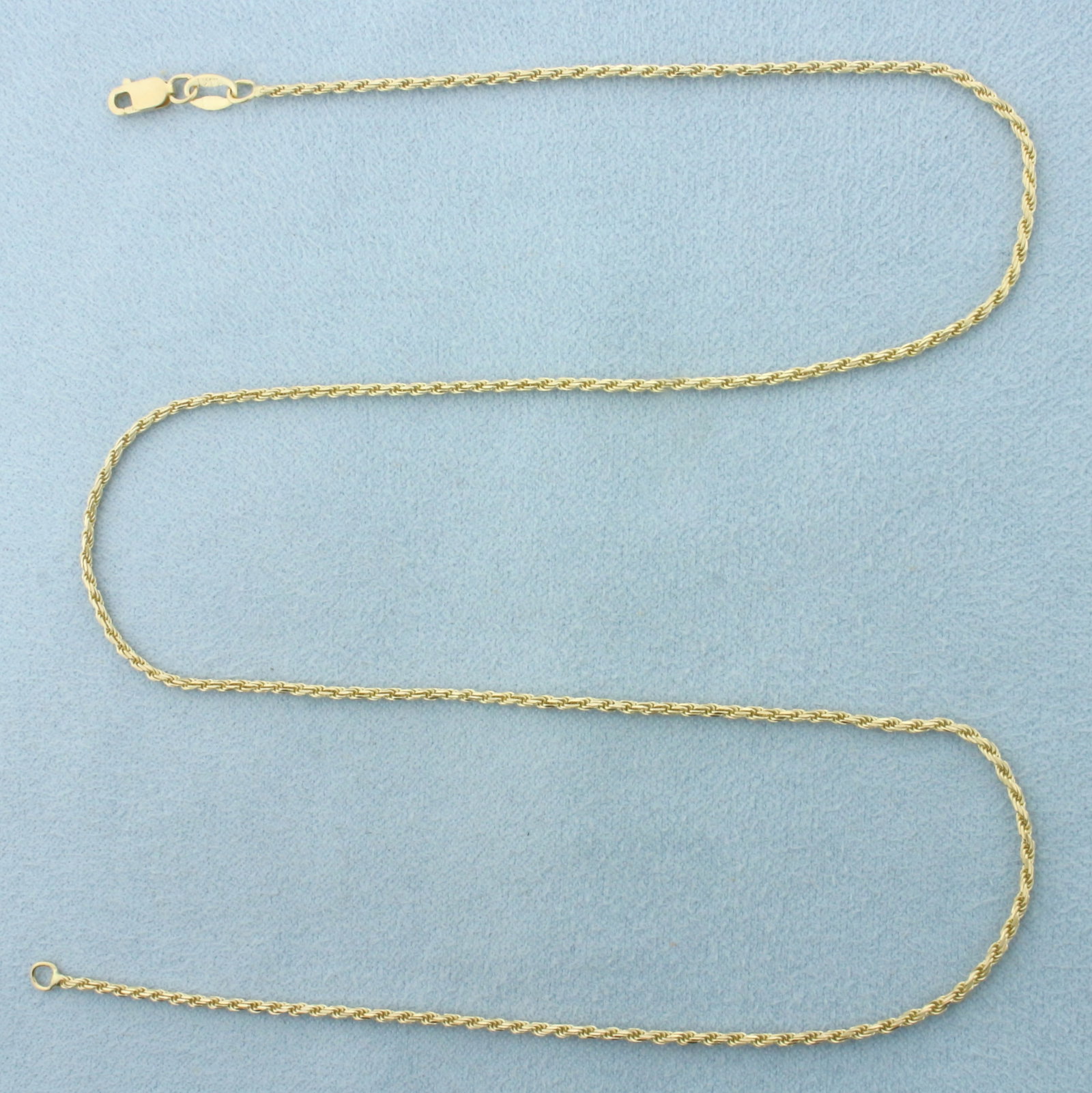 18 Inch Rope Link Chain Necklace in 14k Yellow Gold: In 14k Yellow Gold. 18 inches long. 1.4mm wide. Italian made. Lobster clasp. 4.0g.
