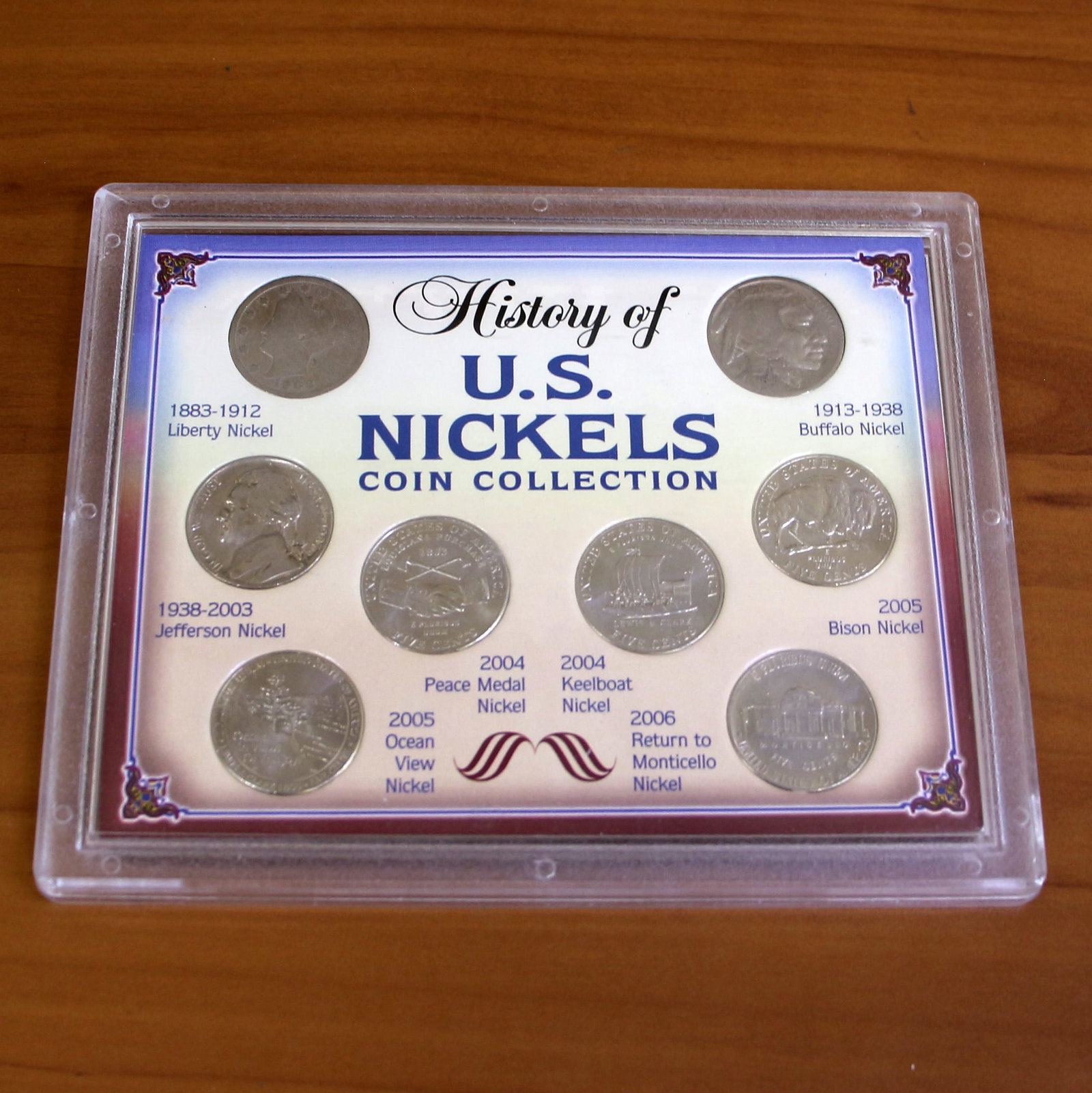 History of US Nickels Coin Collection: Contains one 7-Coin Nickel Coin Collection including: one 1906 Liberty Nickel, 1938 Buffalo Nickel, 1987 Jefferson Nickel, 2004 Peace Medal Nickel, 2005 Ocean View Nickel, 2004 Keelboat Nickel, 2006 R