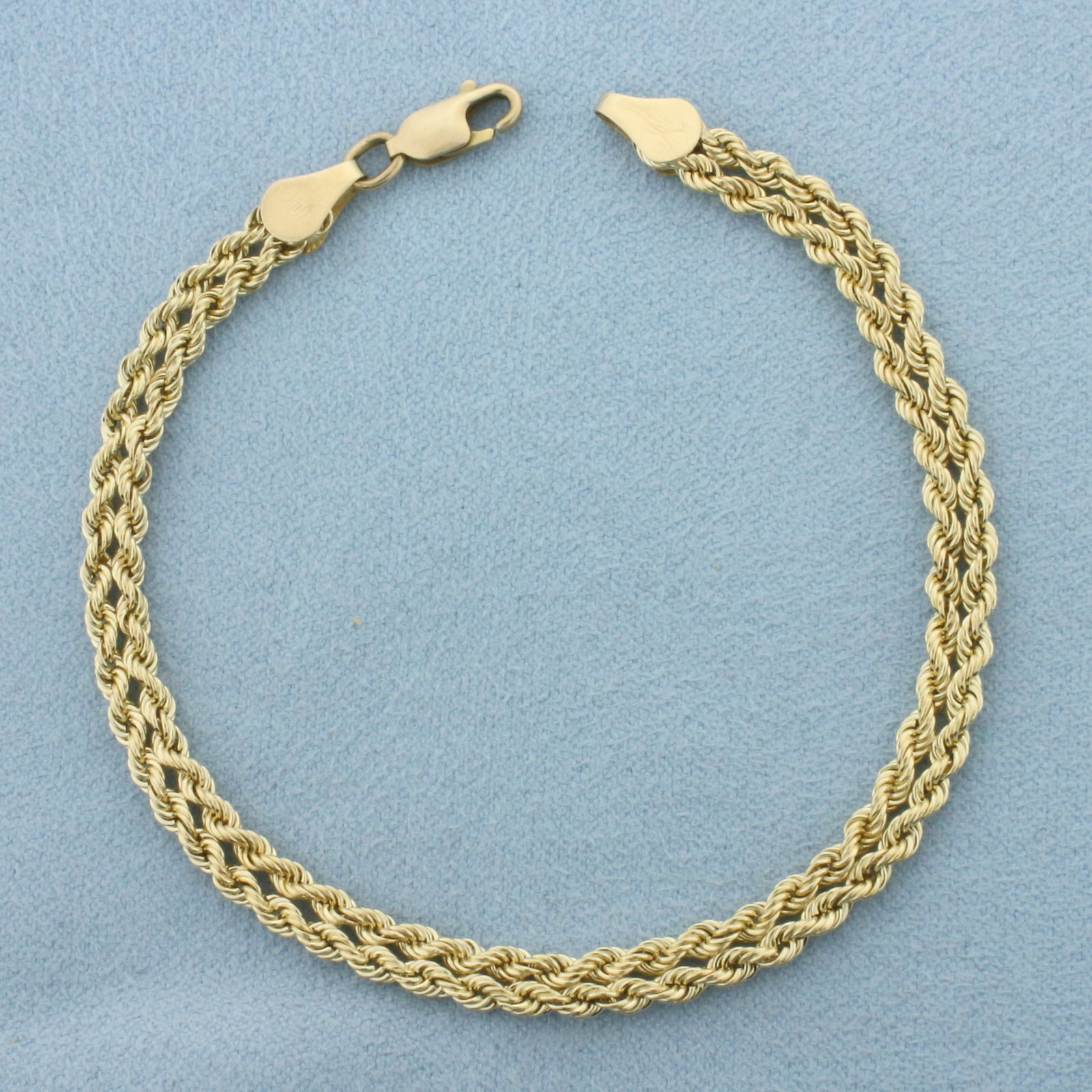 Double Rope Link Bracelet in 10k Yellow Gold: In 10k Yellow Gold. 7 1/2 inches long. 4.6mm wide. Lobster clasp. 2.8g.