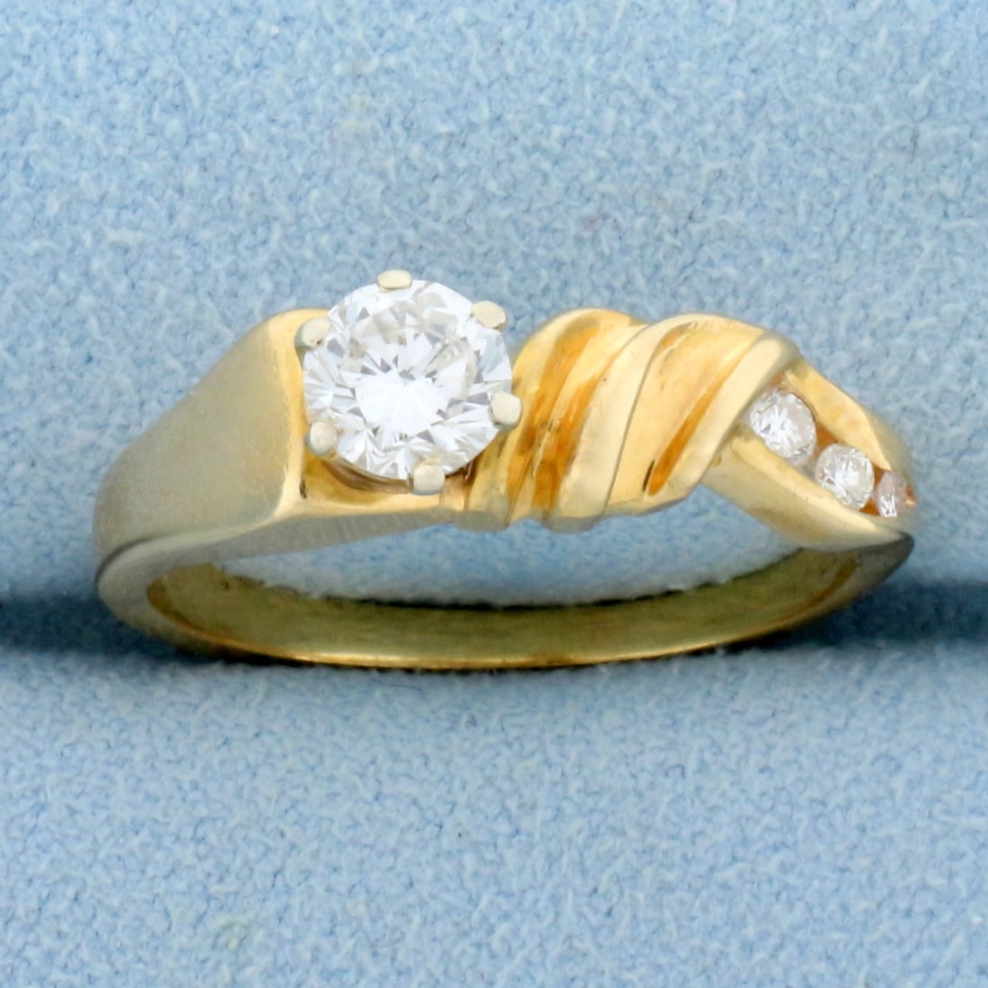 Modern Abstract Design Diamond Ring in 14K Yellow Gold: In 14K Yellow Gold. Contains high quality round brilliant diamonds one 1/2ct, one .04ct, one .02ct, and a .01ct, all VS2 clarity/G color. Size 8 1/2. 3.5g