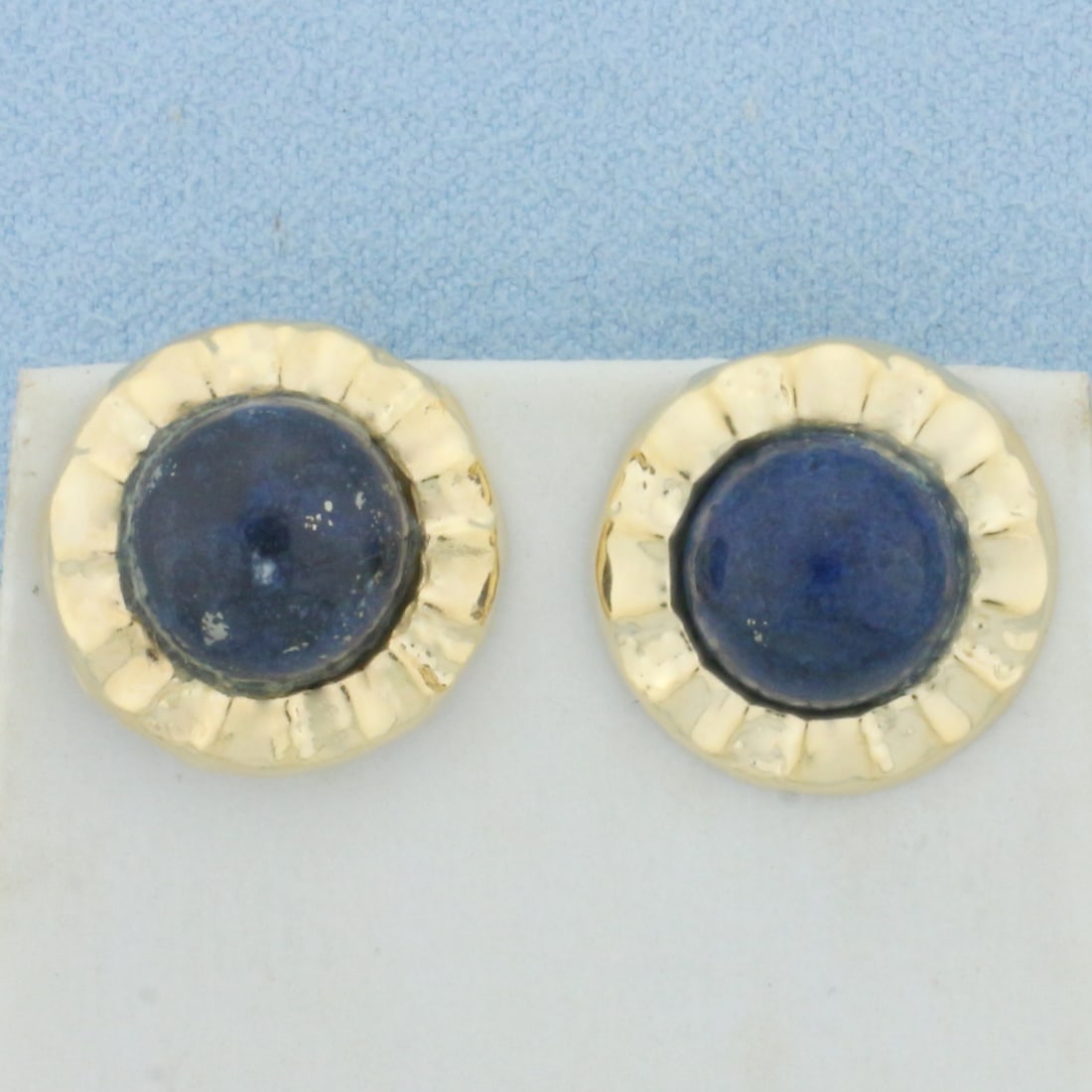 Lapis Lazuli Button Earrings in 14k Yellow Gold: In 14k Yellow Gold. Contains two high quality natural 10mm Lapis Lazuli gemstones with intense color and gold fleks throughout. 5/8 inch diameter. Friction backs. 2.5g.