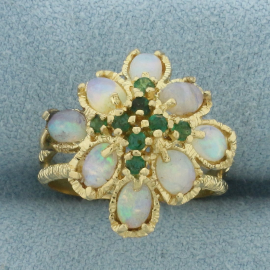 Vintage Opal and Emerald Ring in 14K Yellow Gold: In 14k yellow gold. Measures 18.4mm wide at top of ring. Contains eight high quality natural 2mm Emerald gemstones with bright color. Also contains eight 5.5mm high quality natural Opal gemstones with