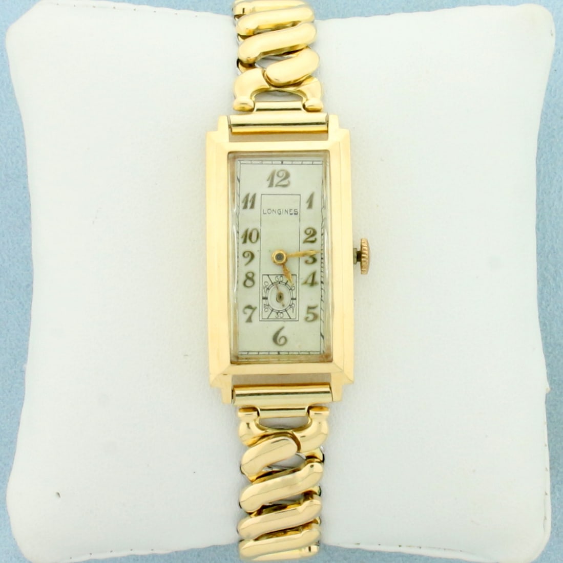 Vintage Womens Longines Watch In Solid 14k Yellow Gold Case: Solid 14k Yellow Gold Case, Gold Plated Band. Manual Windup movement runs great. Watch in great overall condition with no scratching on crystal, minimal scratching on case. 18mm case. 6 7/8 inches lon