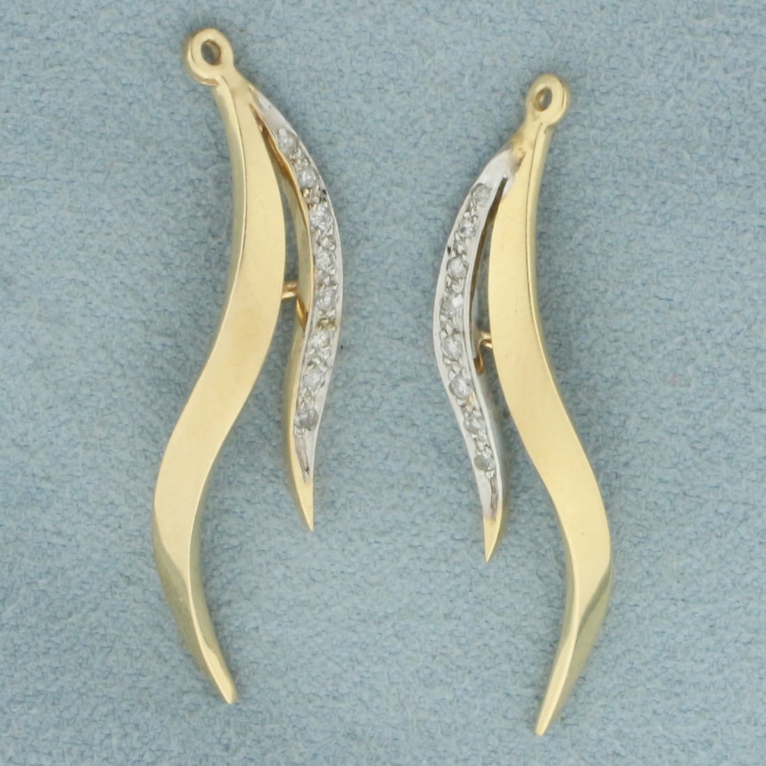 Diamond Drop Earring Enhancers in 14k Yellow Gold: In 14k yellow gold. Contains sixteen high quality 1/2pt diamonds. Created to enhance diamond stud earrings to give them new look. 1 3/8 inches long and 1/4 inches wide. 3.0g.