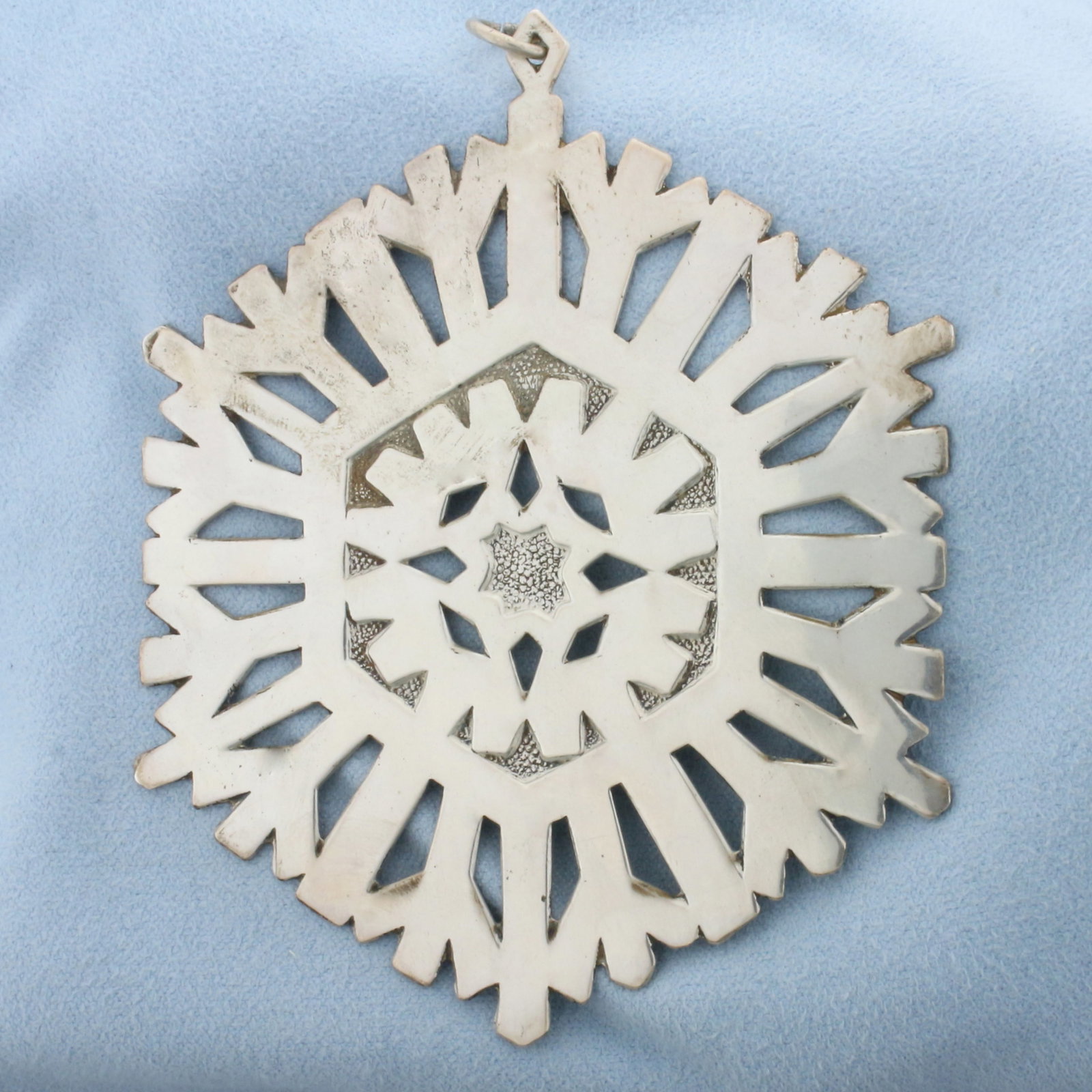 Large Snowflake Pendant in Sterling Silver: In .925 sterling silver. 3 1/2 inches long and 3 inches wide. 30.0g.
