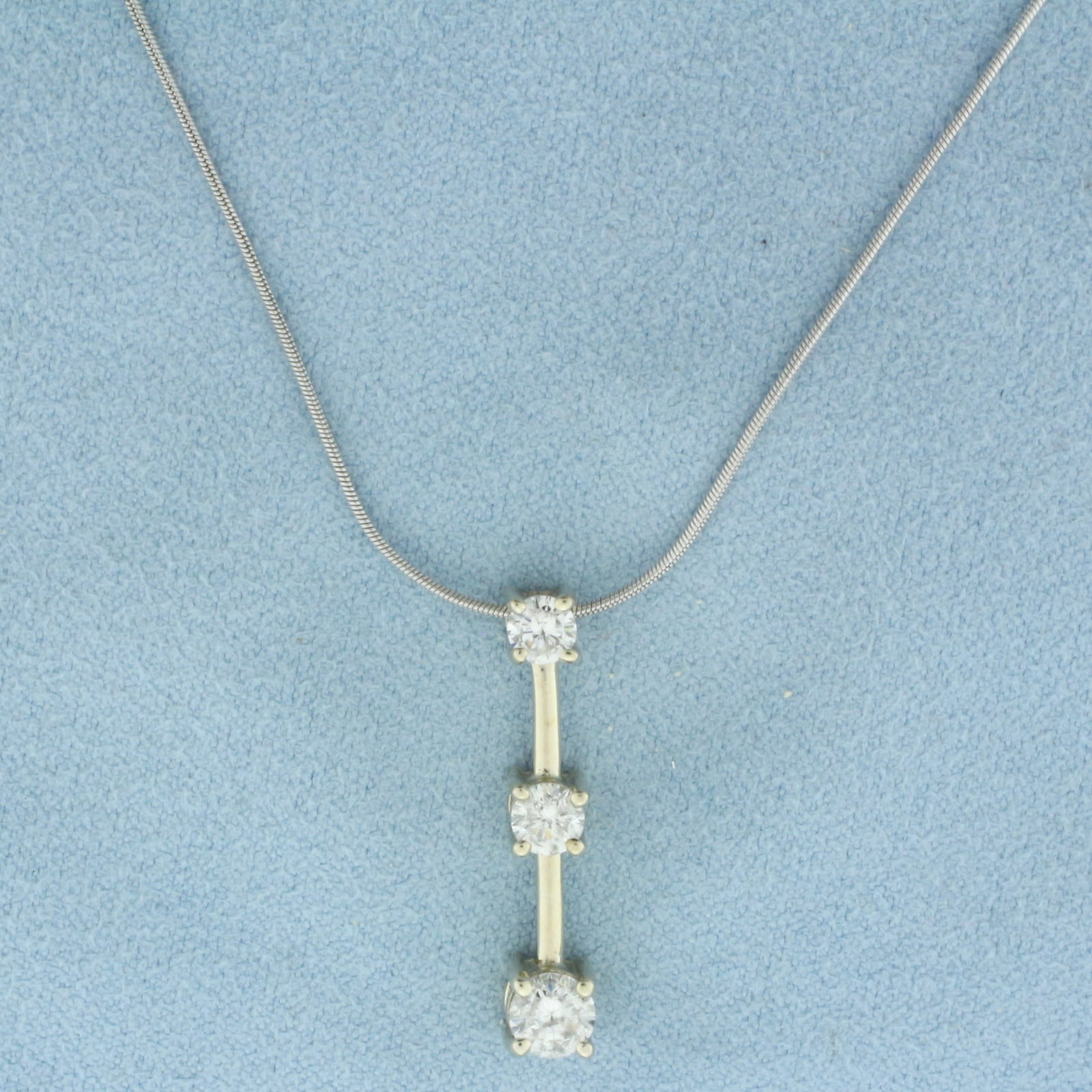 Italian Diamond Past Present Future 3 Stone Necklace in 14k White Gold: In 14k white gold. Italian made. Contains one .4ct, one .25ct, and one .2ct high quality diamonds, H color/I clarity. Snake link chain is 18 inches long, .8mm thick. Pendant is 1 inch long. 4.4g.
