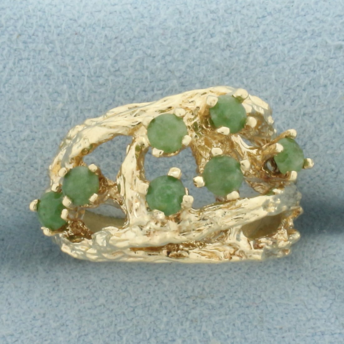 Jade Nature Branch Ring in 14k Yellow Gold: In 14k Yellow Gold. Contains seven 3mm high quality natural Jade gemstones. 13mm wide at center of ring. Size 6.75. 6.9g.