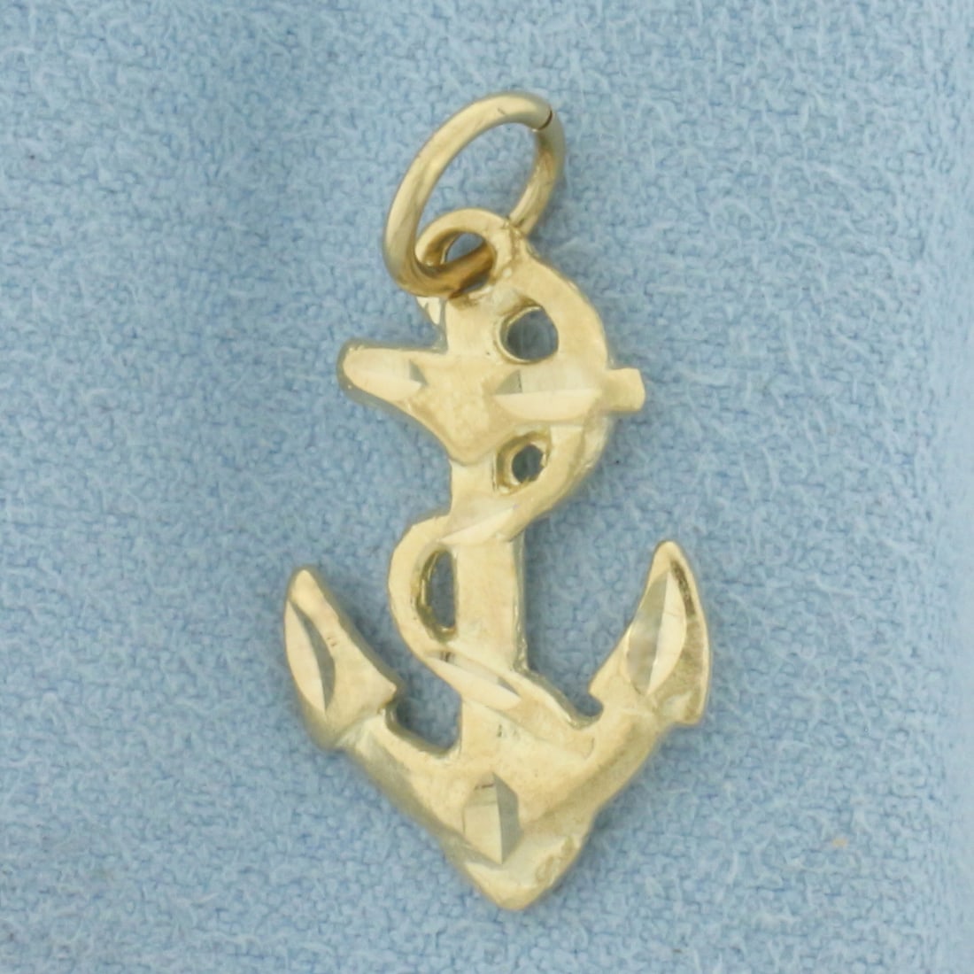 Anchor Charm in 10k Yellow Gold: In 10k Yellow Gold. 1 inch long (including bale). 1/2 inch wide at widest. 1.8g.