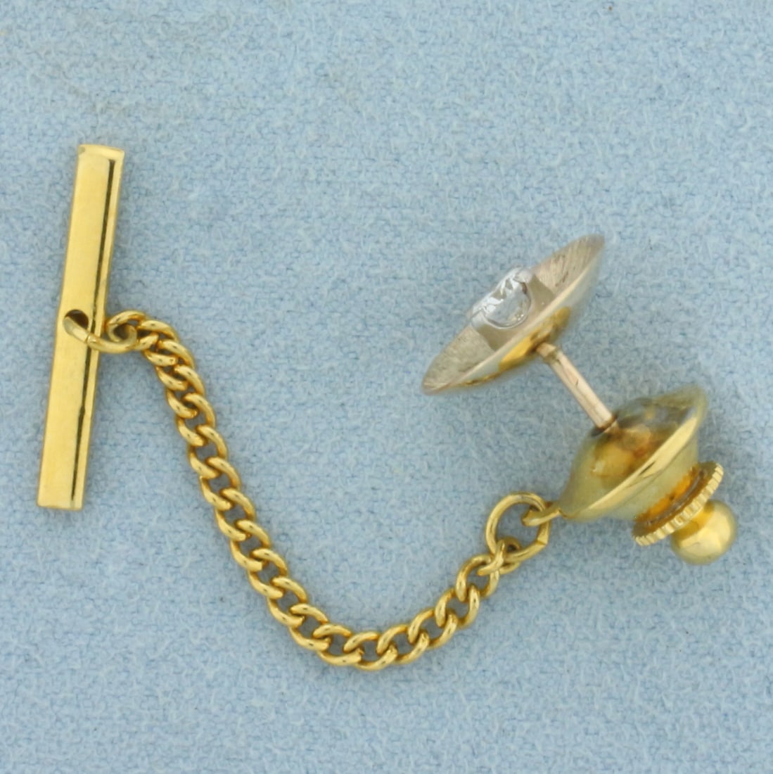 Vintage Diamond Tie Tack Pin in 14k Yellow Gold: In 14k Yellow Gold. Contains one high quality 1/3ct round brilliant diamond VS clarity/G color. 1/2 inch diameter. 3.2g.