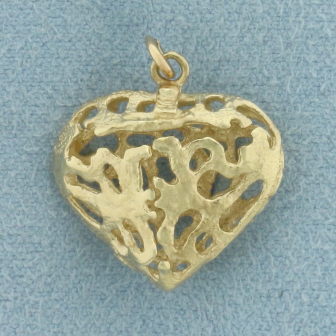 3D Filigree Heart Charm or Pendant in 10k Yellow Gold: In 10k Yellow Gold. 5/8 inch long. 5/8 inch wide. 1.9g.