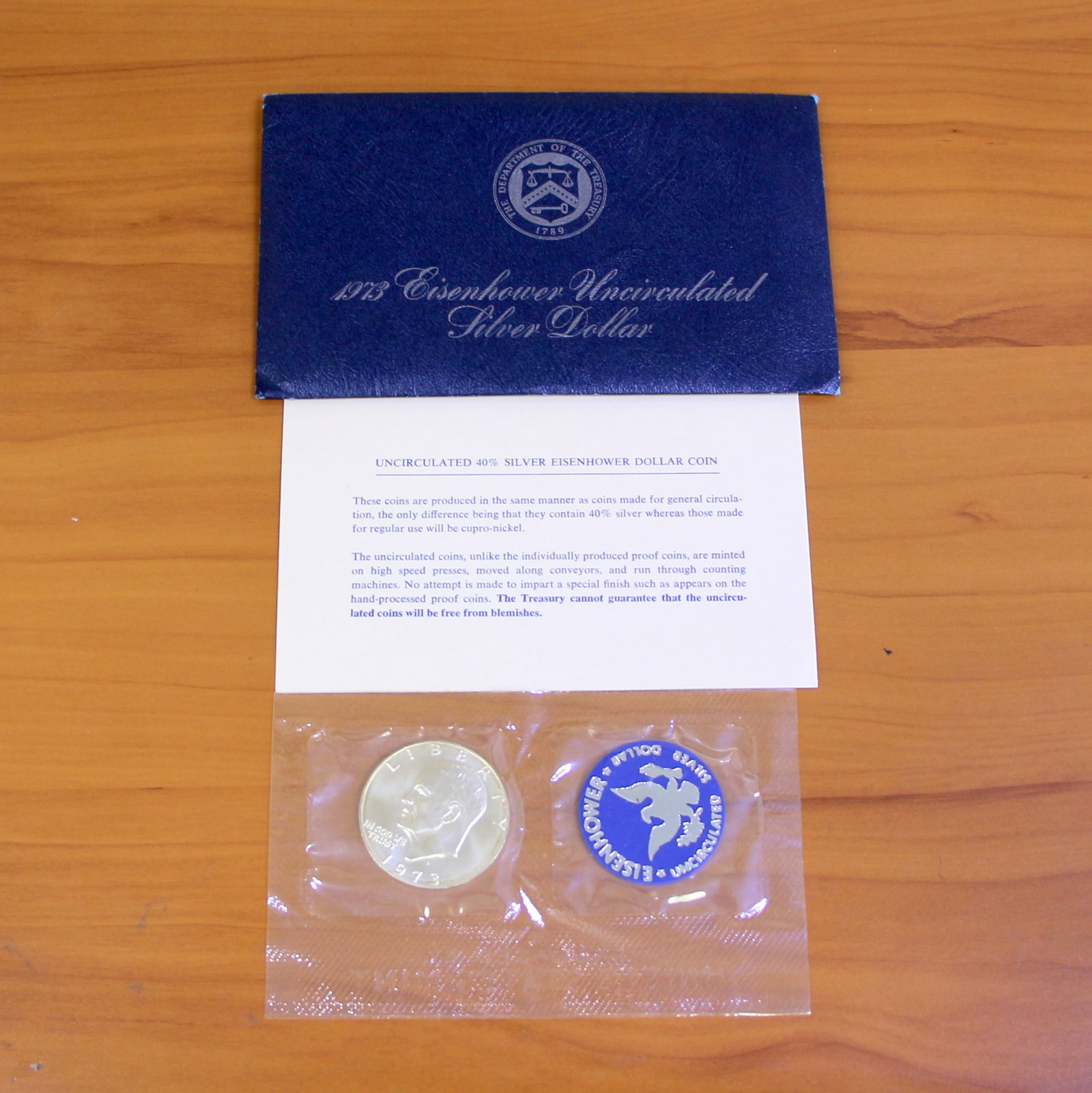 Uncirculated Silver Eisenhower Dollar Coin OGP: One set from 1971-1973. Contains one Uncirculated 40% Silver Eisenhower Silver Dollar. Set in original packaging and contains certificate of authenticity.