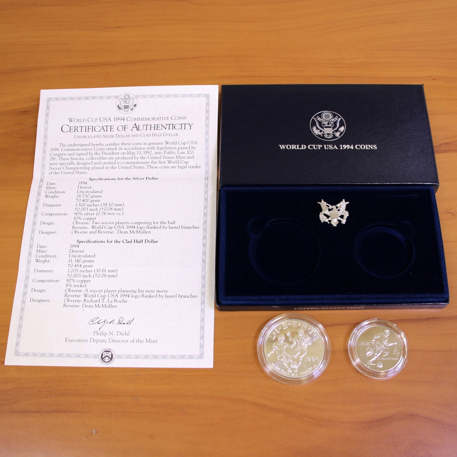 US Mint World Cup USA Uncirculated Coin Set OGP: Contains one 1994 90% Silver Uncirculated World Cup USA Silver Dollar. Also contains one 1994 Uncirculated World Cup USA Clad Half Dollar. Set in original government packaging and contains certificate